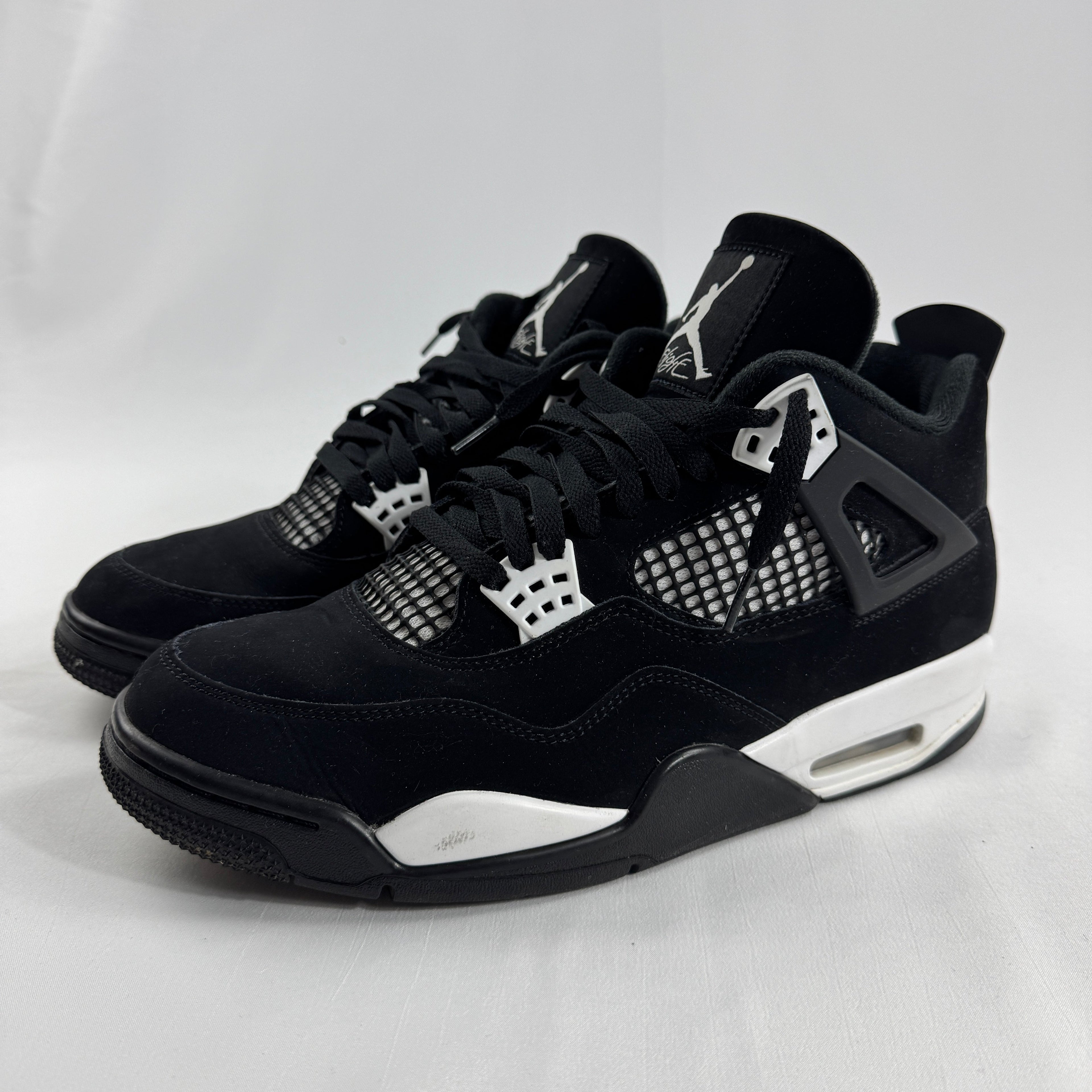 Air Jordan 4 Retro Black/White is a clean, classic version of the Jordan 4 with a black and white leather upper, mesh side