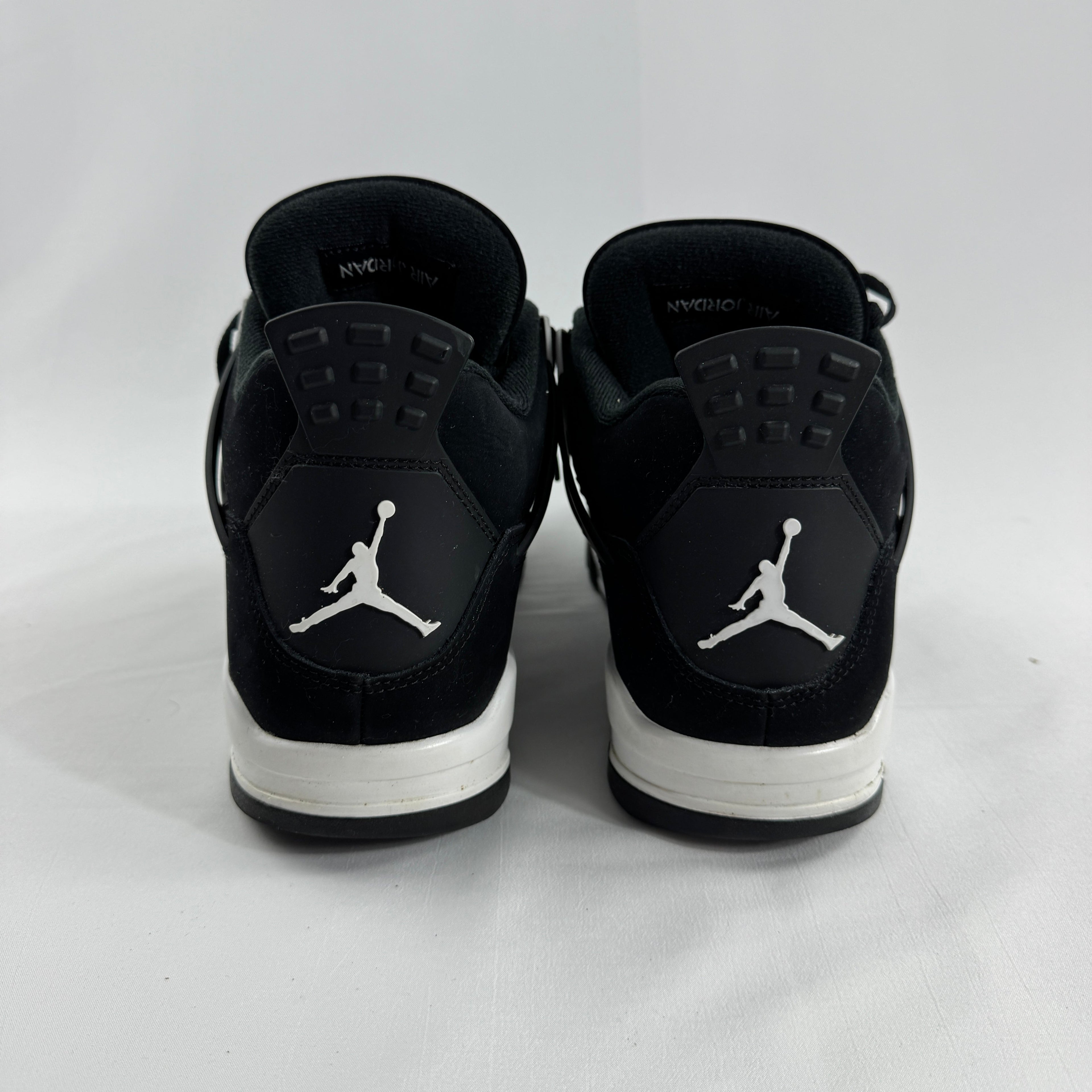 Air Jordan 4 Retro Black/White is a clean, classic version of the Jordan 4 with a black and white leather upper, mesh side