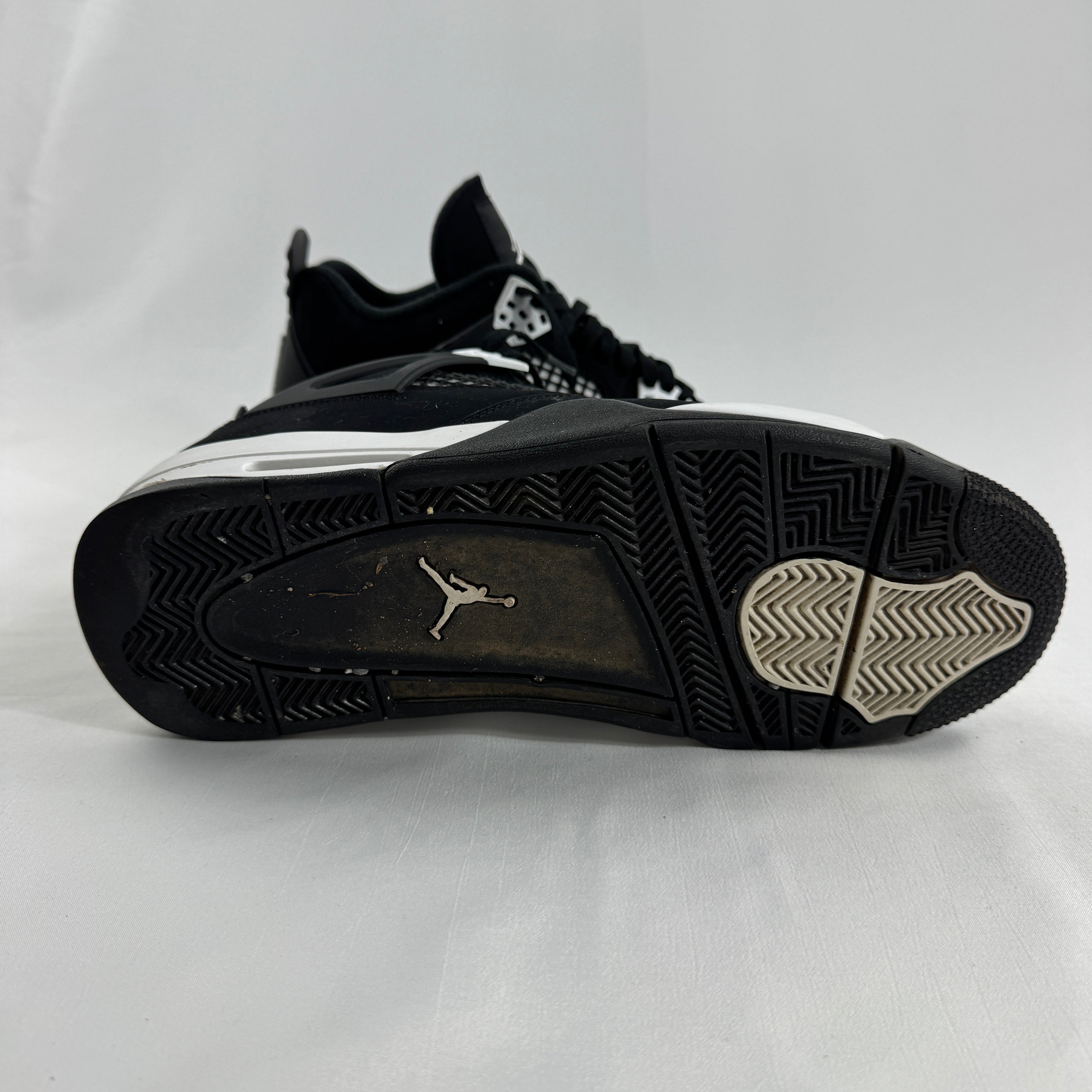 Air Jordan 4 Retro Black/White is a clean, classic version of the Jordan 4 with a black and white leather upper, mesh side