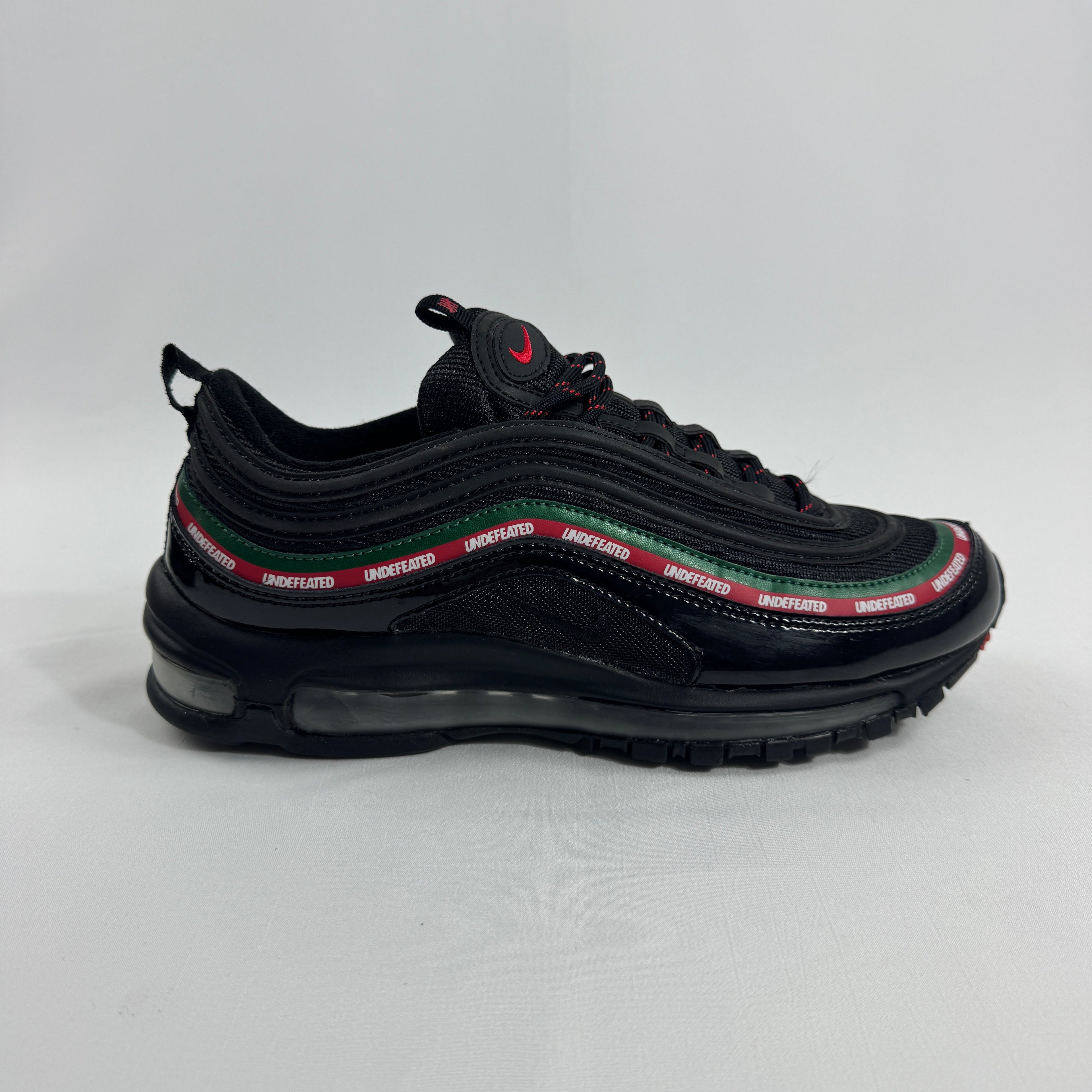 Air Max 97 Undefeated Black Volt combines the iconic Air Max 97 design with Undefeated’s bold streetwear aesthetic.