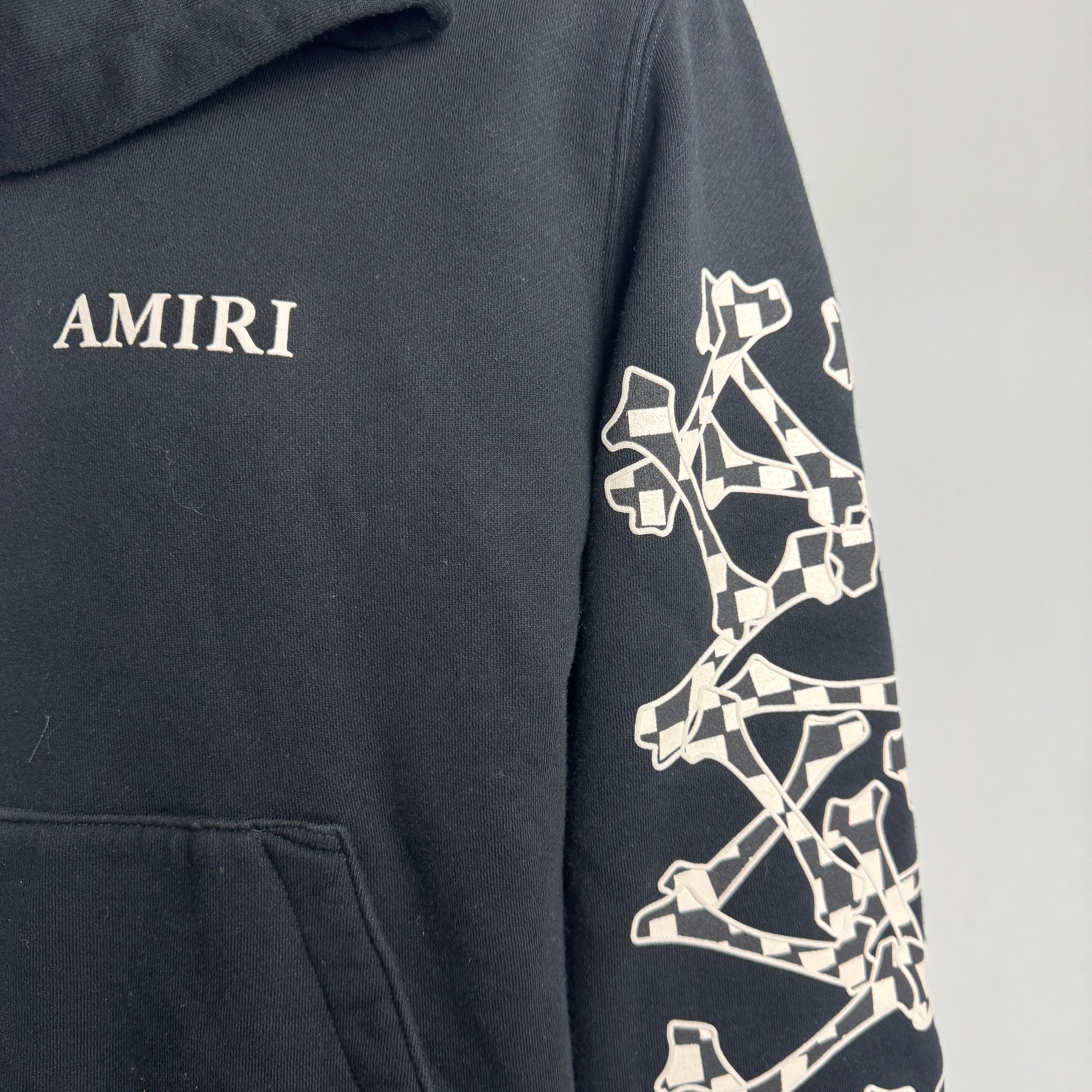 Amiri Bones Stacked Hoodie crafted from premium cotton, featuring the iconic Bones graphic, adjustable drawstring hood,