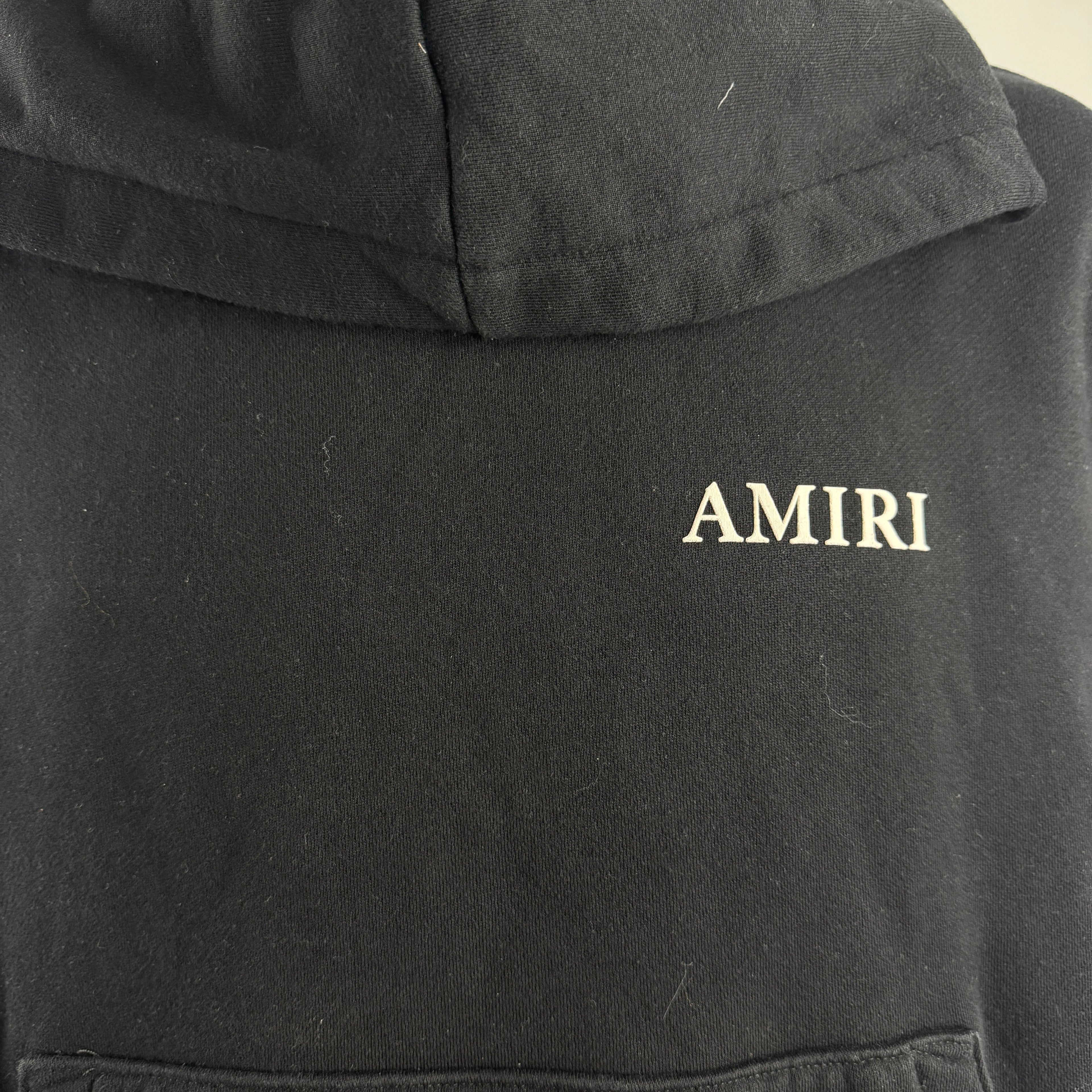 Amiri Bones Stacked Hoodie crafted from premium cotton, featuring the iconic Bones graphic, adjustable drawstring hood,