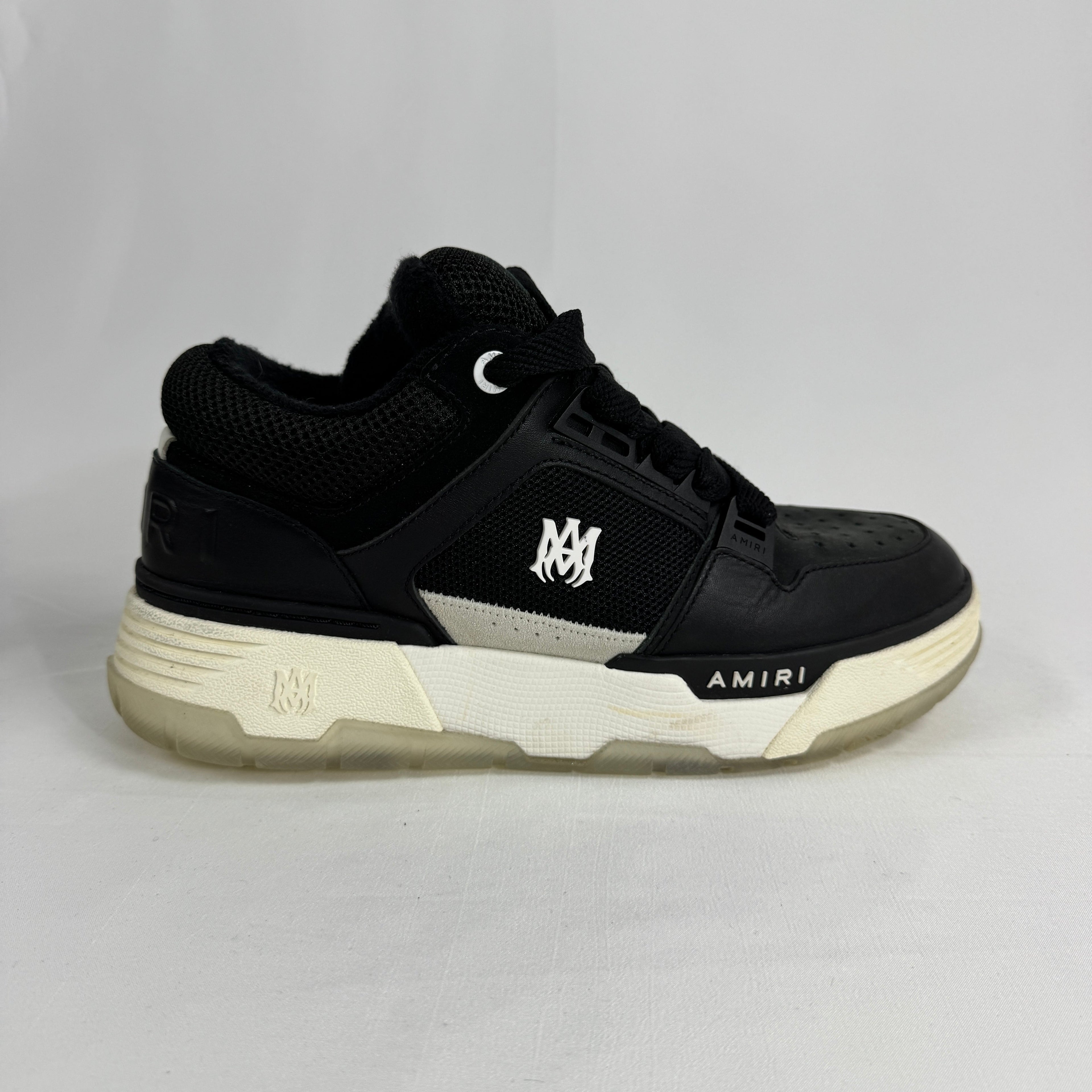 The Amiri MA-1 Trainers showcase a luxury take on classic basketball-inspired footwear. Crafted from premium leather with