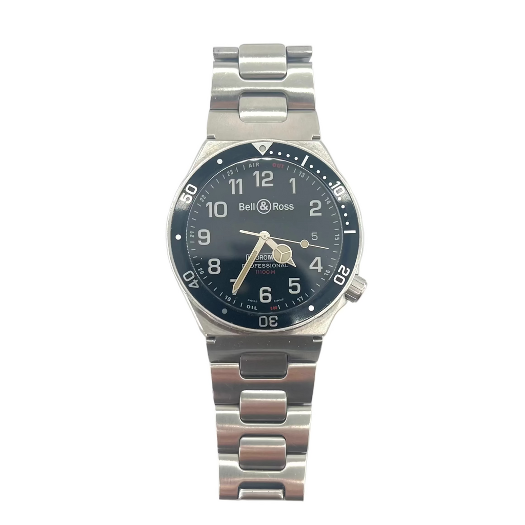 Bell and Ross watch with a metal band, black bezel and face, silver hands, white numerals on a white background with extra straps.