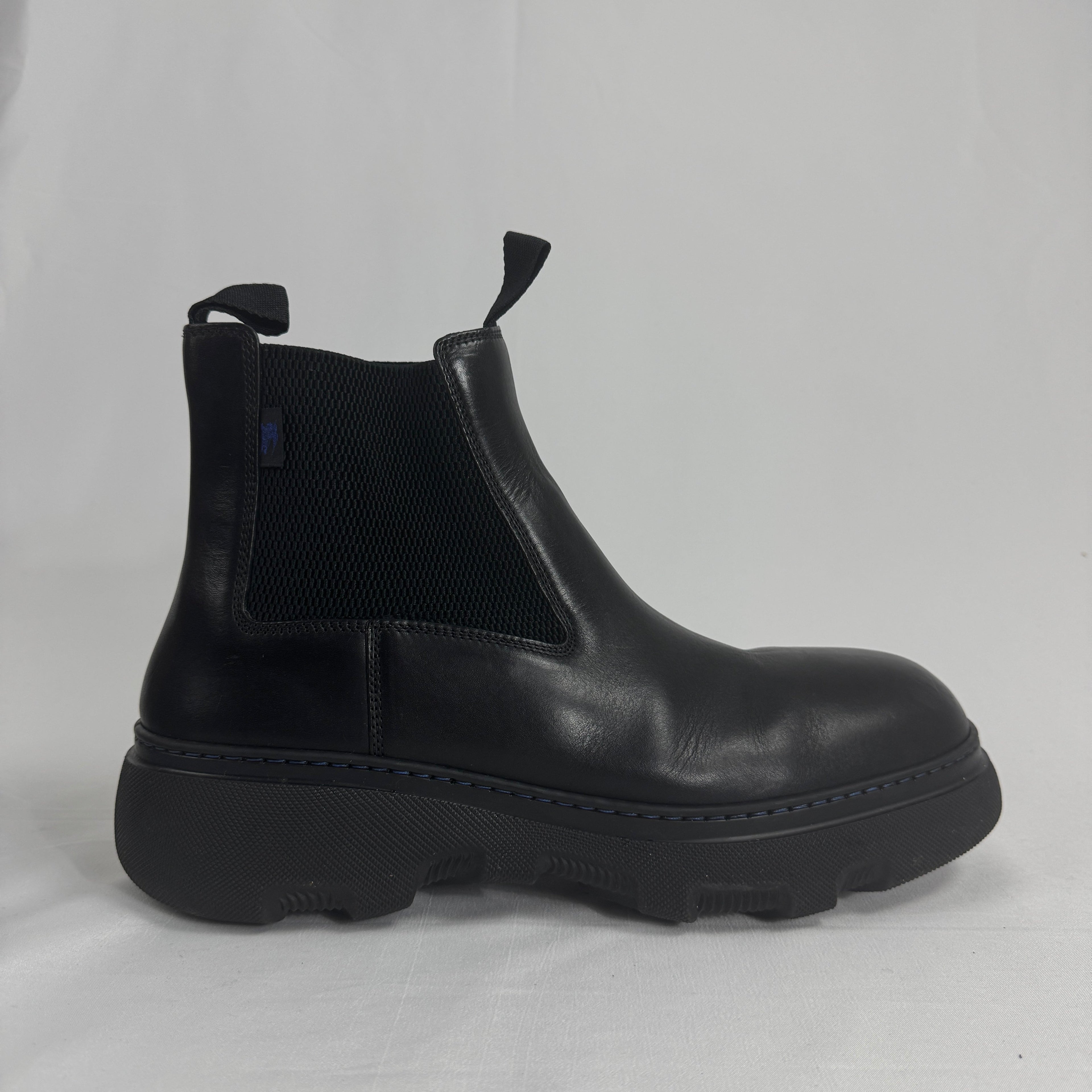 The Burberry Creeper Chelsea Low is a modern take on the classic Chelsea boot, blending sleek British tailoring with a