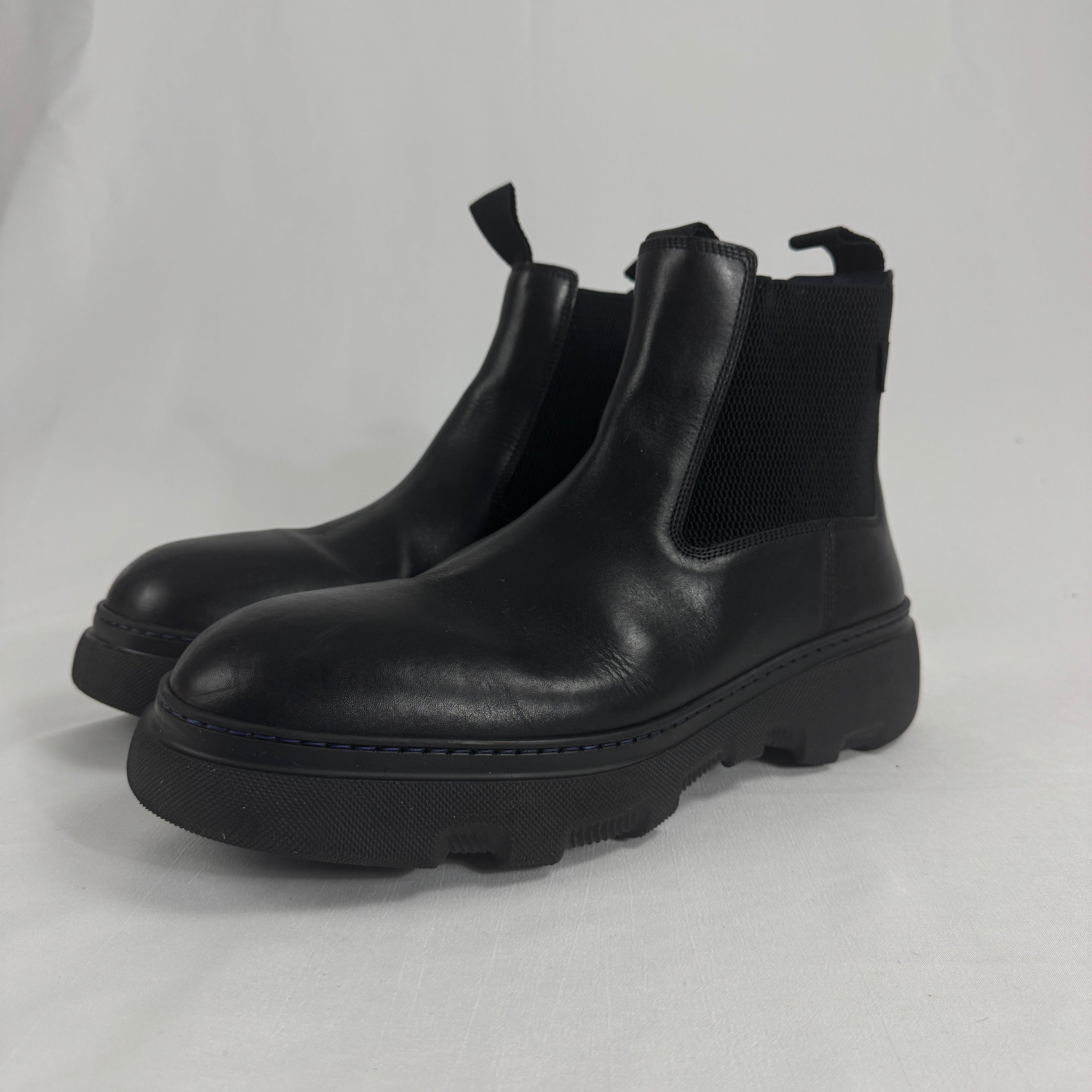 The Burberry Creeper Chelsea Low is a modern take on the classic Chelsea boot, blending sleek British tailoring with a