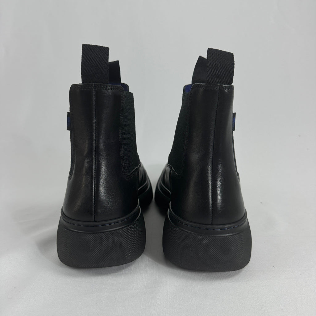 The Burberry Creeper Chelsea Low is a modern take on the classic Chelsea boot, blending sleek British tailoring with a