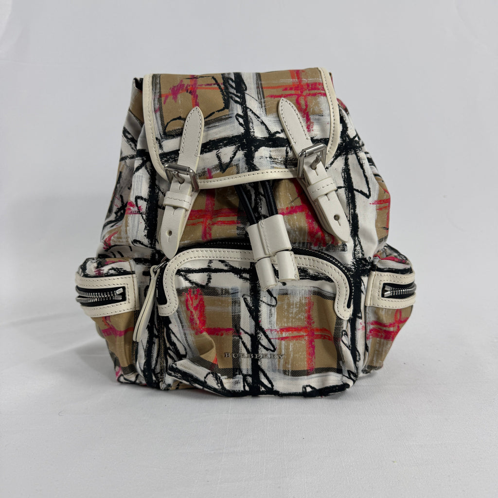 The Burberry Multi Canvas Backpack is a luxury backpack made from durable canvas with Burberry’s signature patterns and