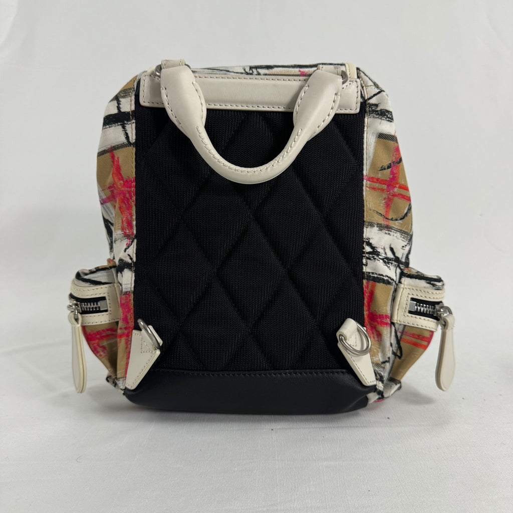 The Burberry Multi Canvas Backpack is a luxury backpack made from durable canvas with Burberry’s signature patterns and