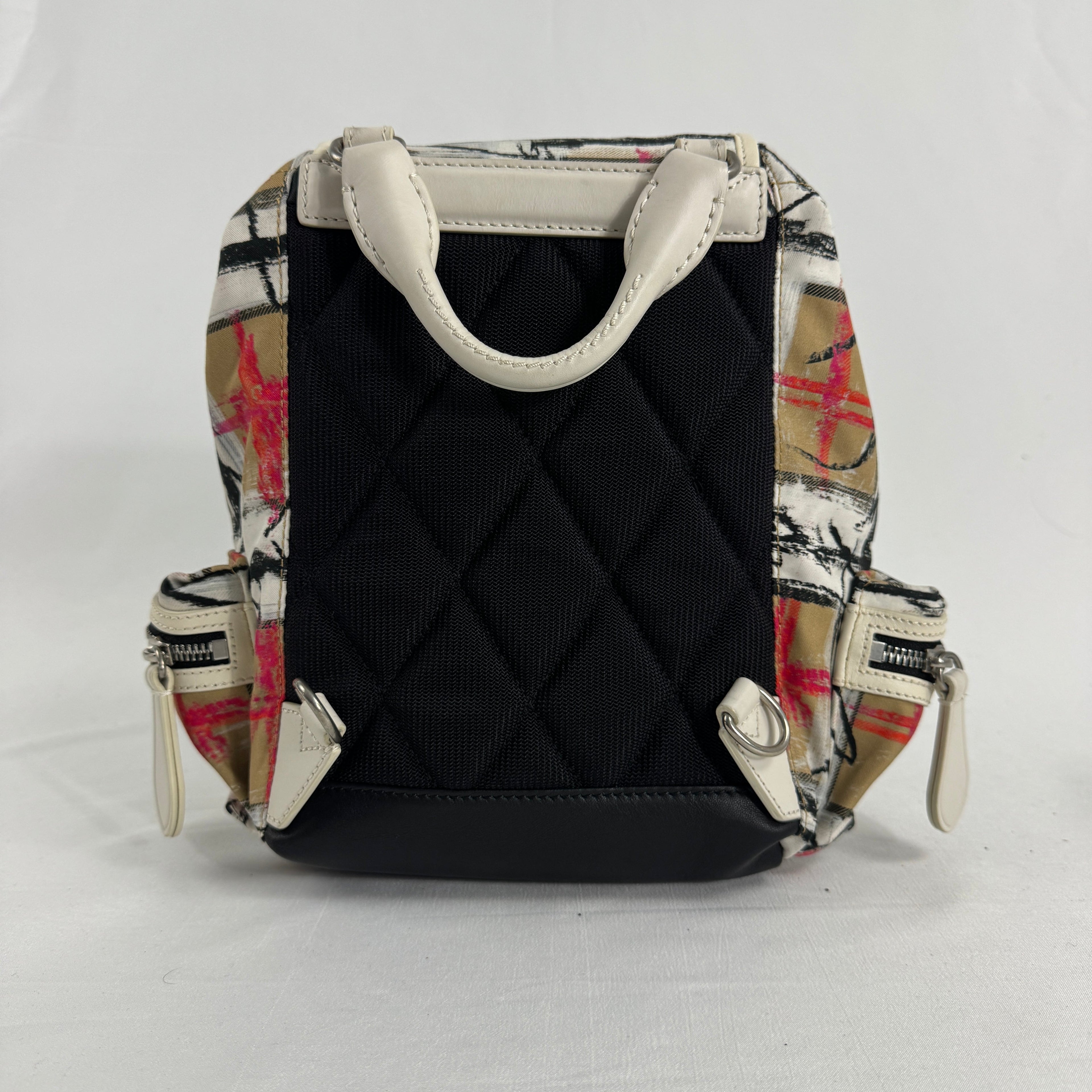 The Burberry Multi Canvas Backpack is a luxury backpack made from durable canvas with Burberry’s signature patterns and