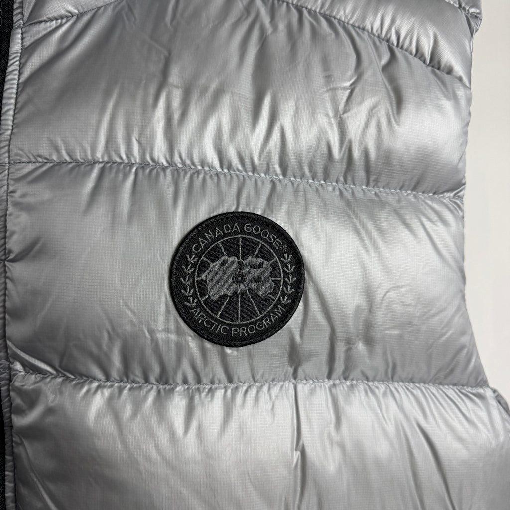 The Canada Goose Crofton Gilet is a lightweight, packable down vest designed for layering in cold but not extreme weather.