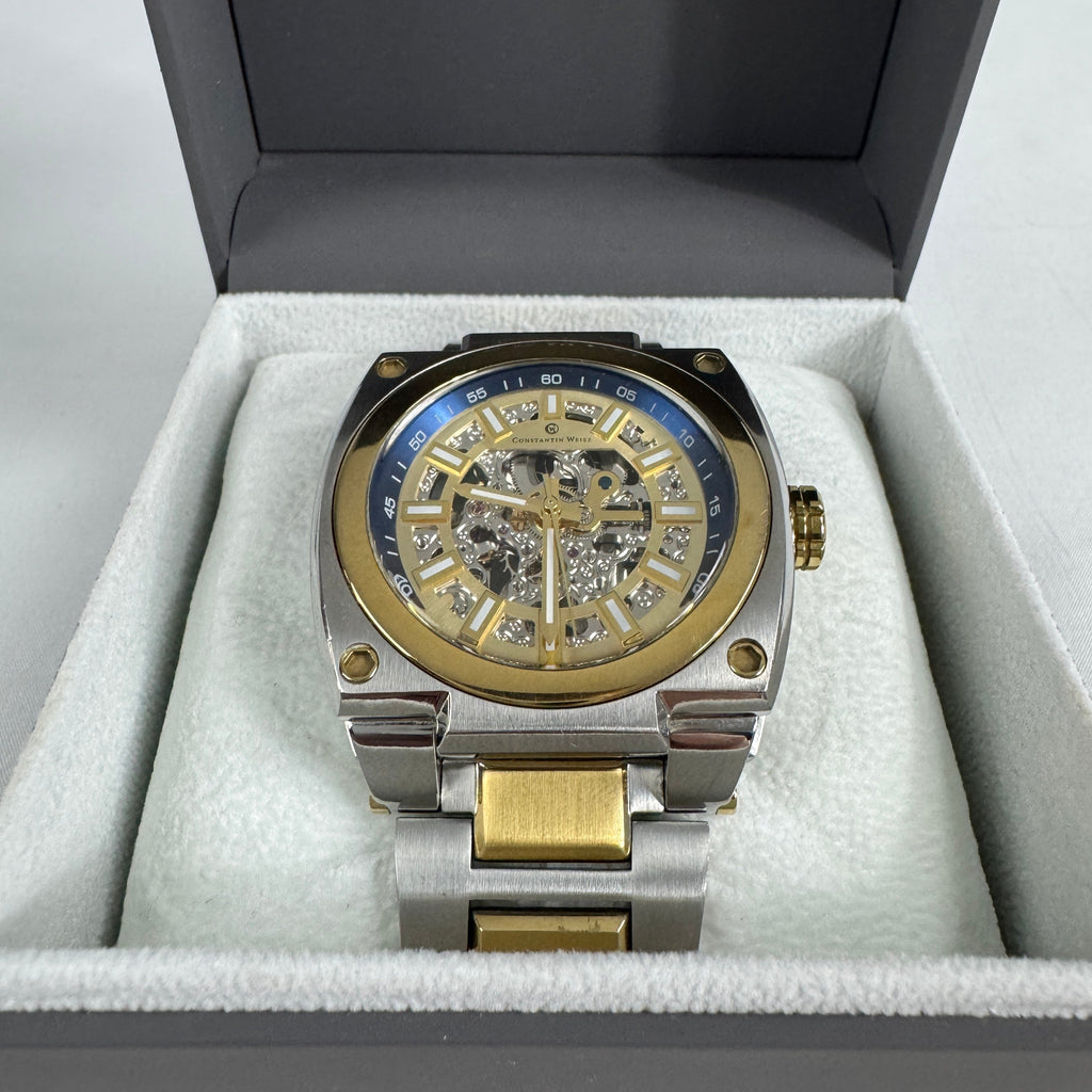 The Constantin Weisz Two Tone Skeleton Automatic is a mechanical watch featuring a visible skeleton dial, a stainless steel