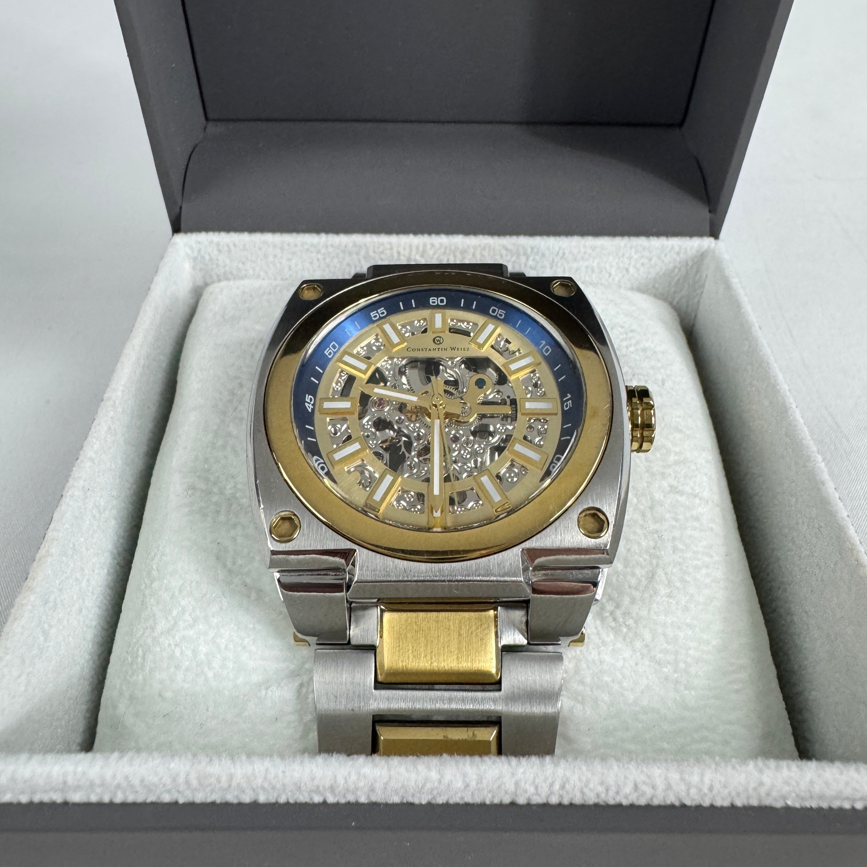 The Constantin Weisz Two Tone Skeleton Automatic is a mechanical watch featuring a visible skeleton dial, a stainless steel