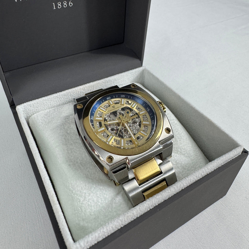 The Constantin Weisz Two Tone Skeleton Automatic is a mechanical watch featuring a visible skeleton dial, a stainless steel