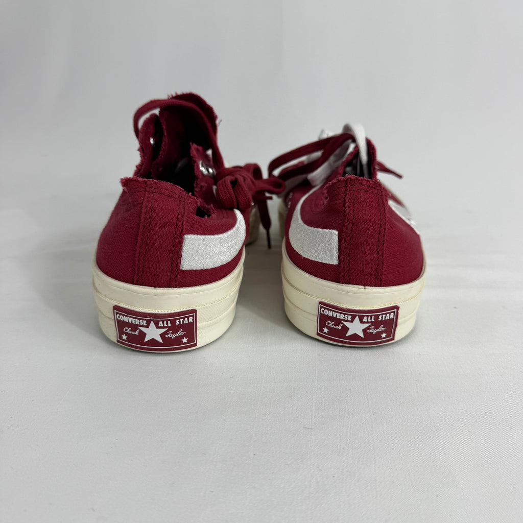 The Converse Chuck 70 Ox Red is a classic low-top sneaker featuring a durable canvas upper, vintage-inspired details, and