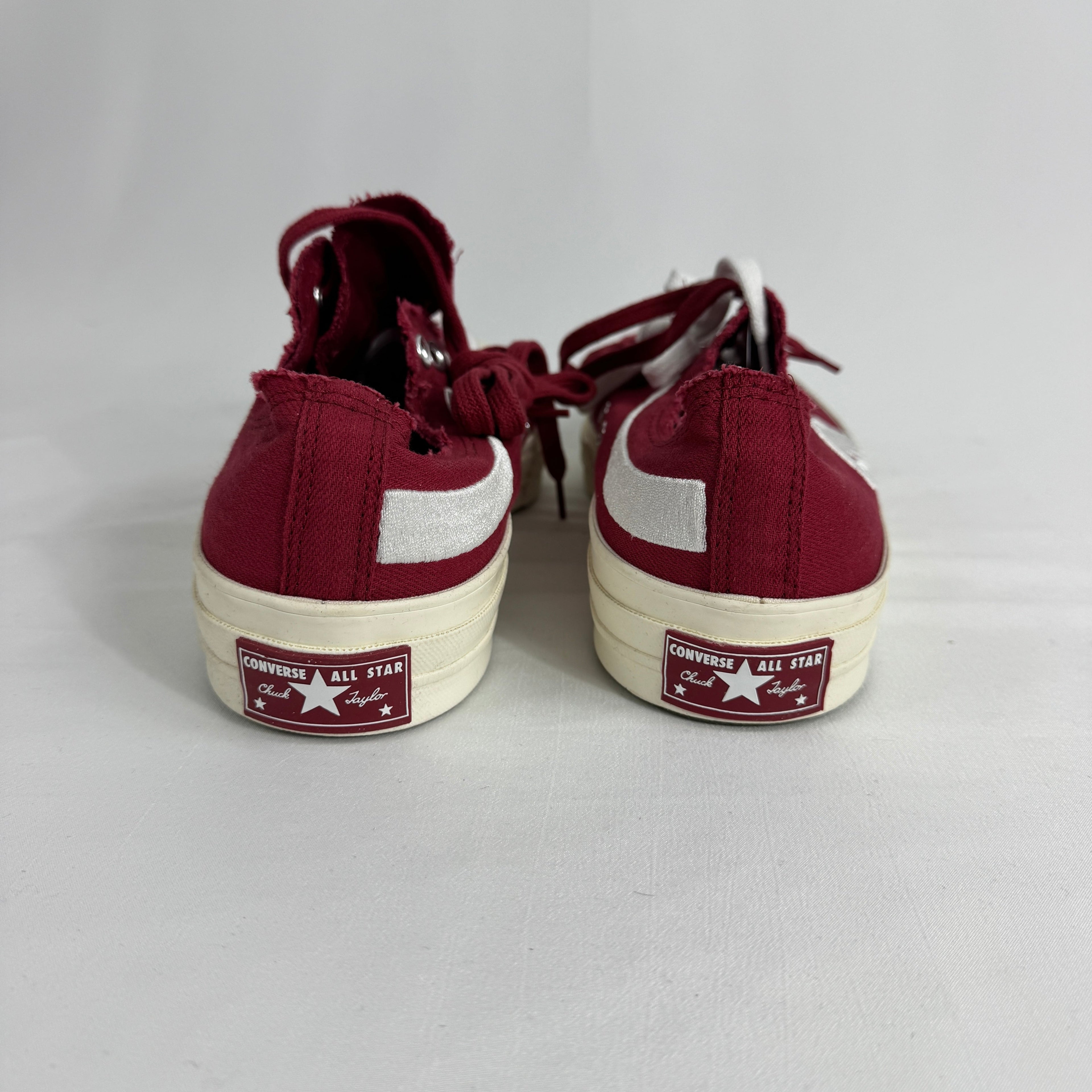 The Converse Chuck 70 Ox Red is a classic low-top sneaker featuring a durable canvas upper, vintage-inspired details, and
