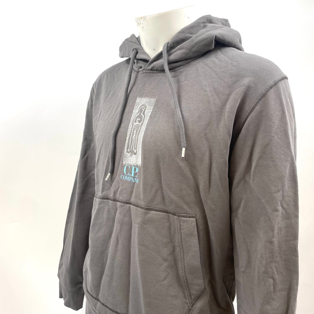 CP Company Graphic Hoodie crafted from premium cotton, featuring a bold graphic design, adjustable drawstring hood, ribbed