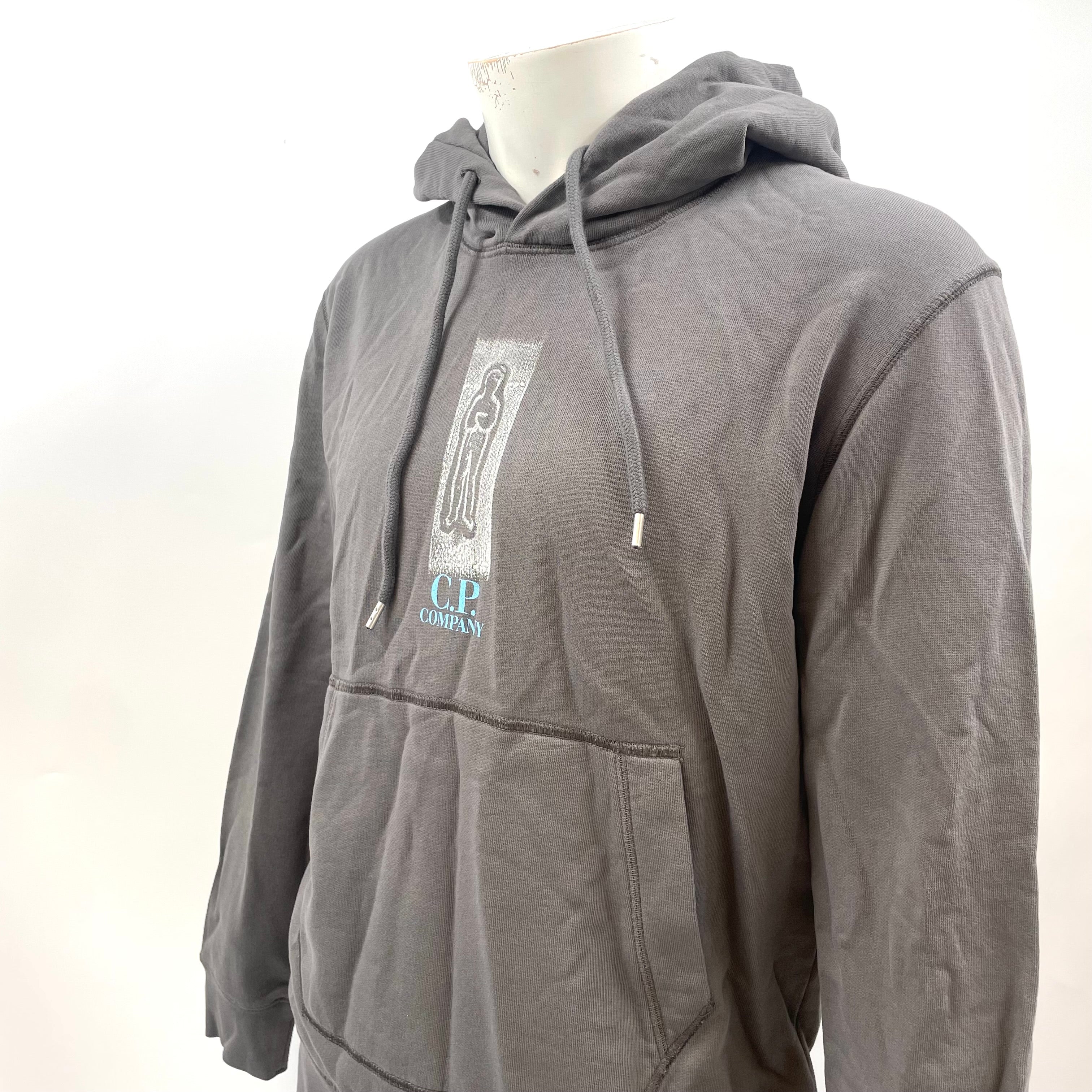 CP Company Graphic Hoodie crafted from premium cotton, featuring a bold graphic design, adjustable drawstring hood, ribbed