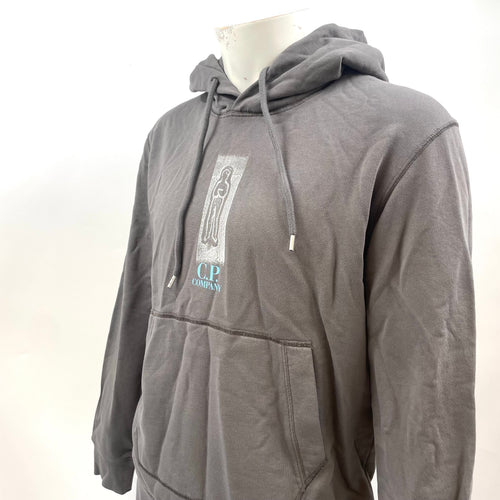 CP Company Graphic Hoodie crafted from premium cotton, featuring a bold graphic design, adjustable drawstring hood, ribbed