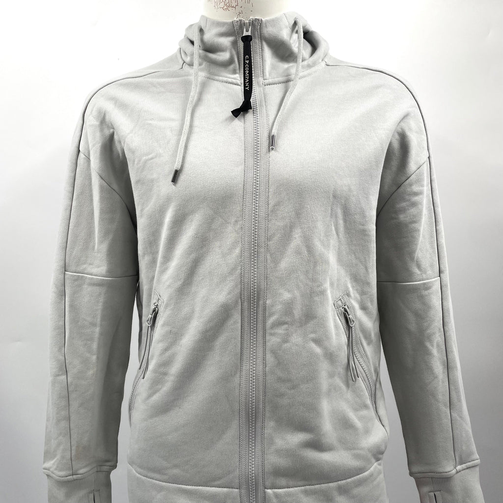 CP Company Hooded Zipup Grey crafted from premium fabric, featuring a full zip closure, adjustable hood, signature C.P.
