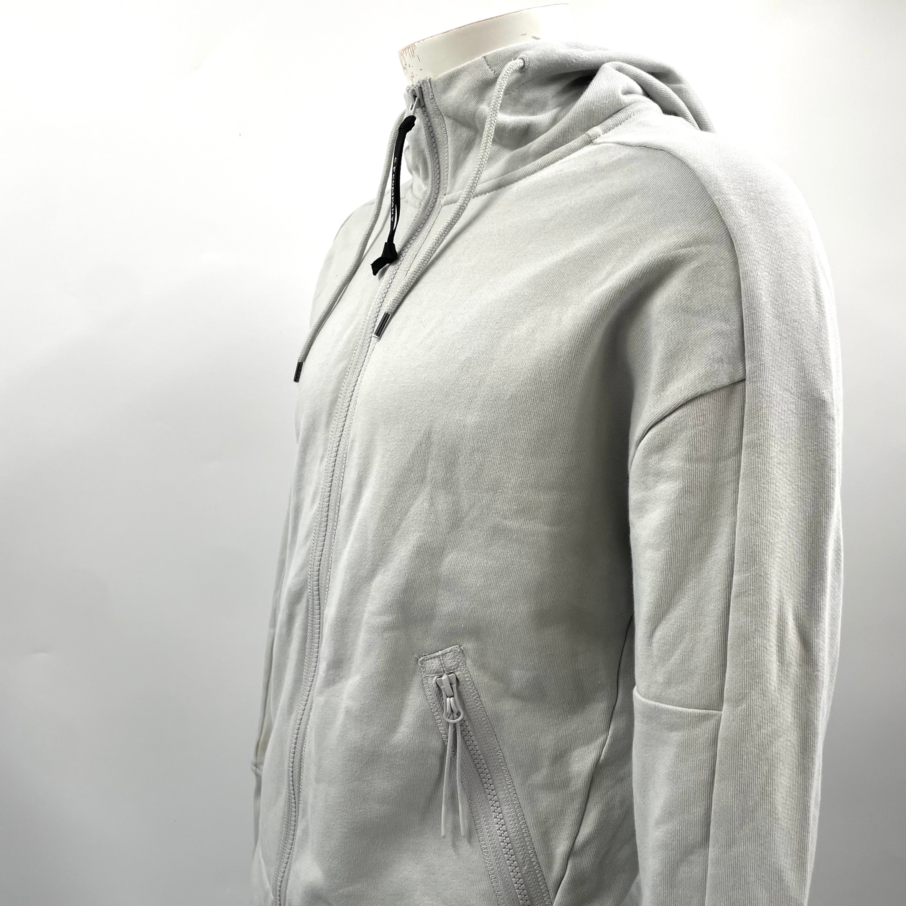CP Company Hooded Zipup Grey crafted from premium fabric, featuring a full zip closure, adjustable hood, signature C.P.