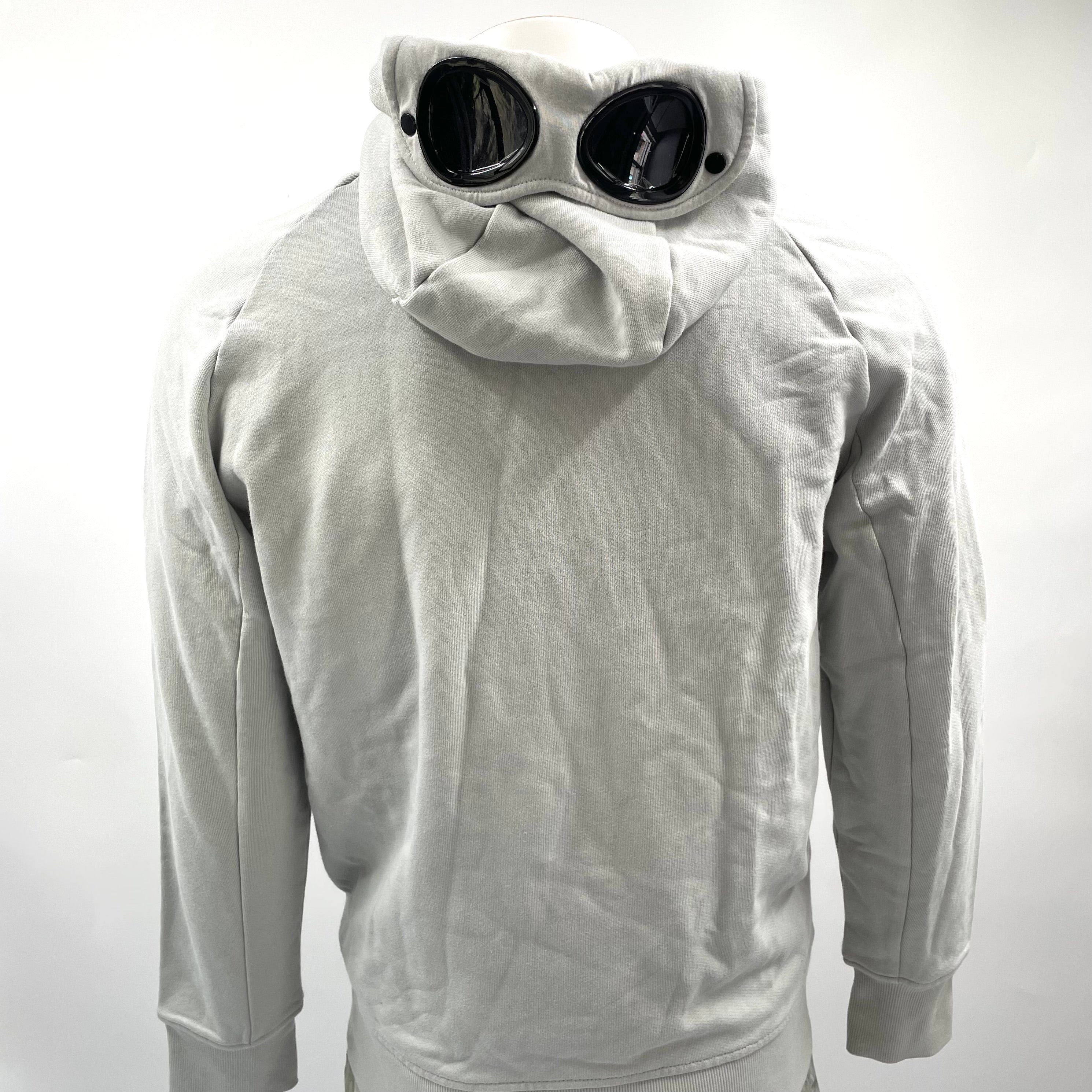 CP Company Hooded Zipup Grey crafted from premium fabric, featuring a full zip closure, adjustable hood, signature C.P.