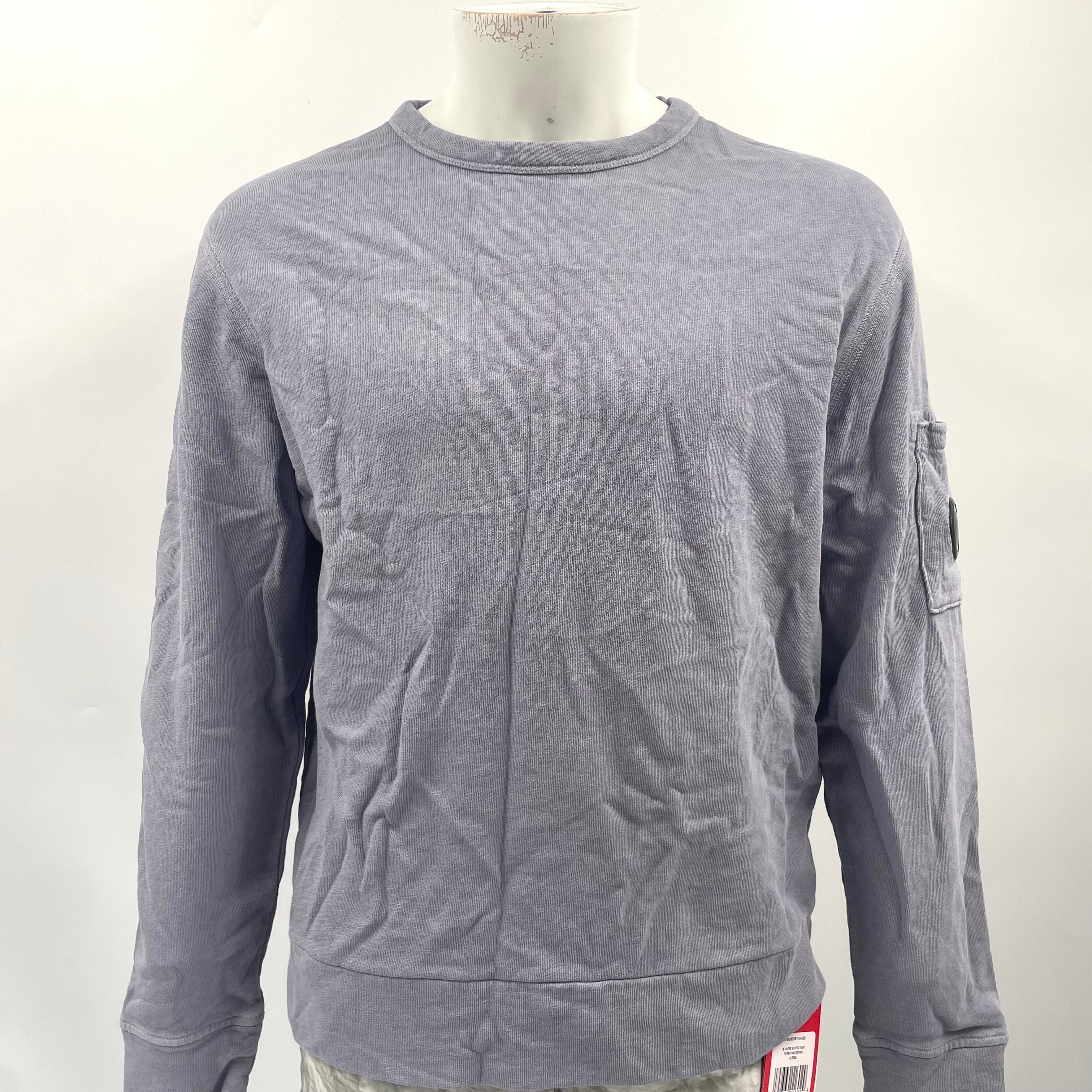 CP Company Lavender Crew Neck crafted from premium cotton, featuring a classic crew neck design, signature C.P. Company