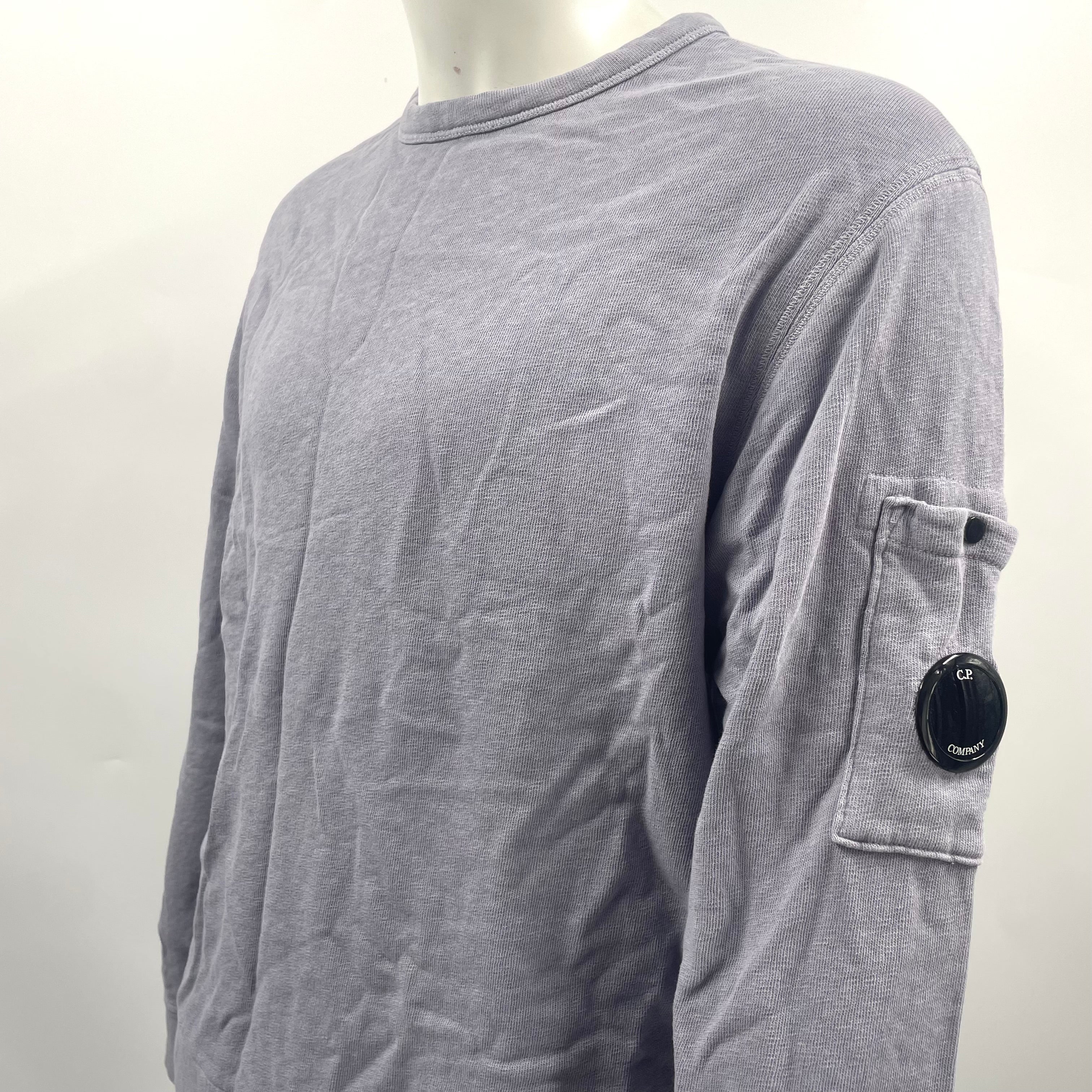 CP Company Lavender Crew Neck crafted from premium cotton, featuring a classic crew neck design, signature C.P. Company