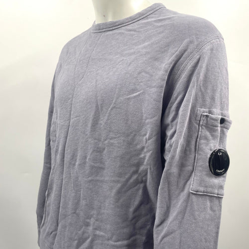 CP Company Lavender Crew Neck crafted from premium cotton, featuring a classic crew neck design, signature C.P. Company