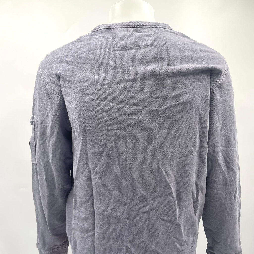 CP Company Lavender Crew Neck crafted from premium cotton, featuring a classic crew neck design, signature C.P. Company