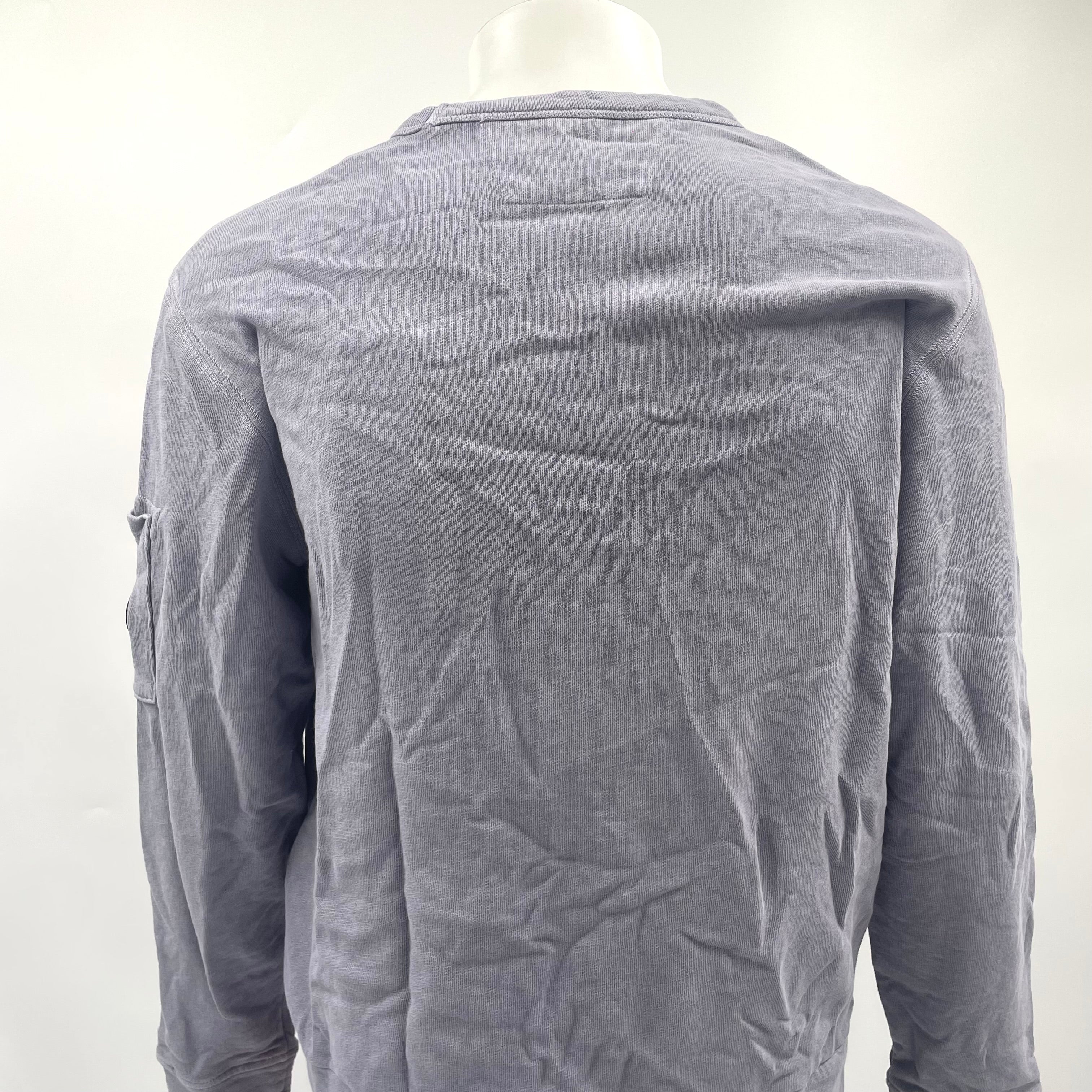 CP Company Lavender Crew Neck crafted from premium cotton, featuring a classic crew neck design, signature C.P. Company