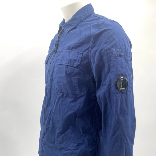 CP Company Navy Overshirt crafted from premium fabric, featuring a classic button-front design, signature C.P. Company