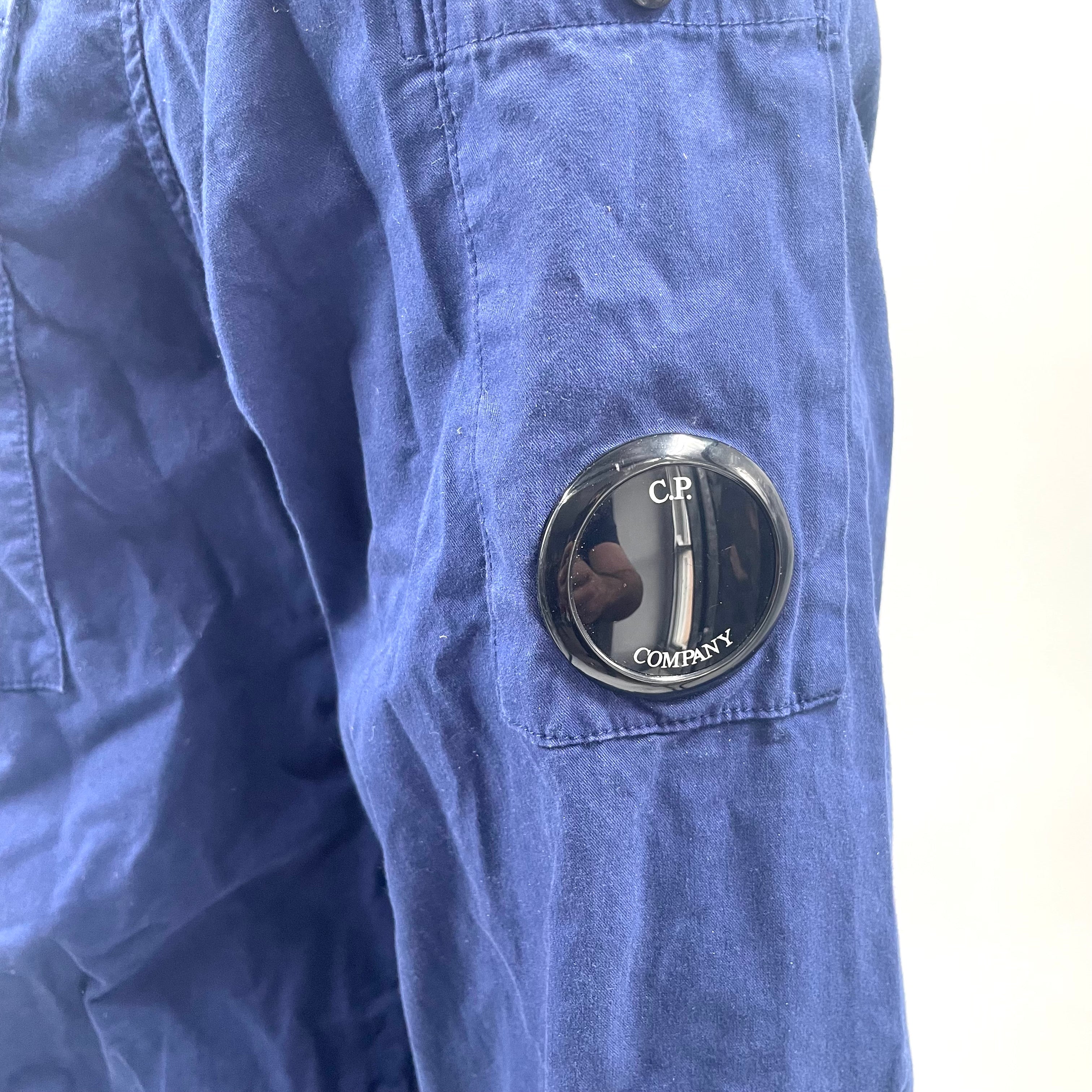 CP Company Navy Overshirt crafted from premium fabric, featuring a classic button-front design, signature C.P. Company