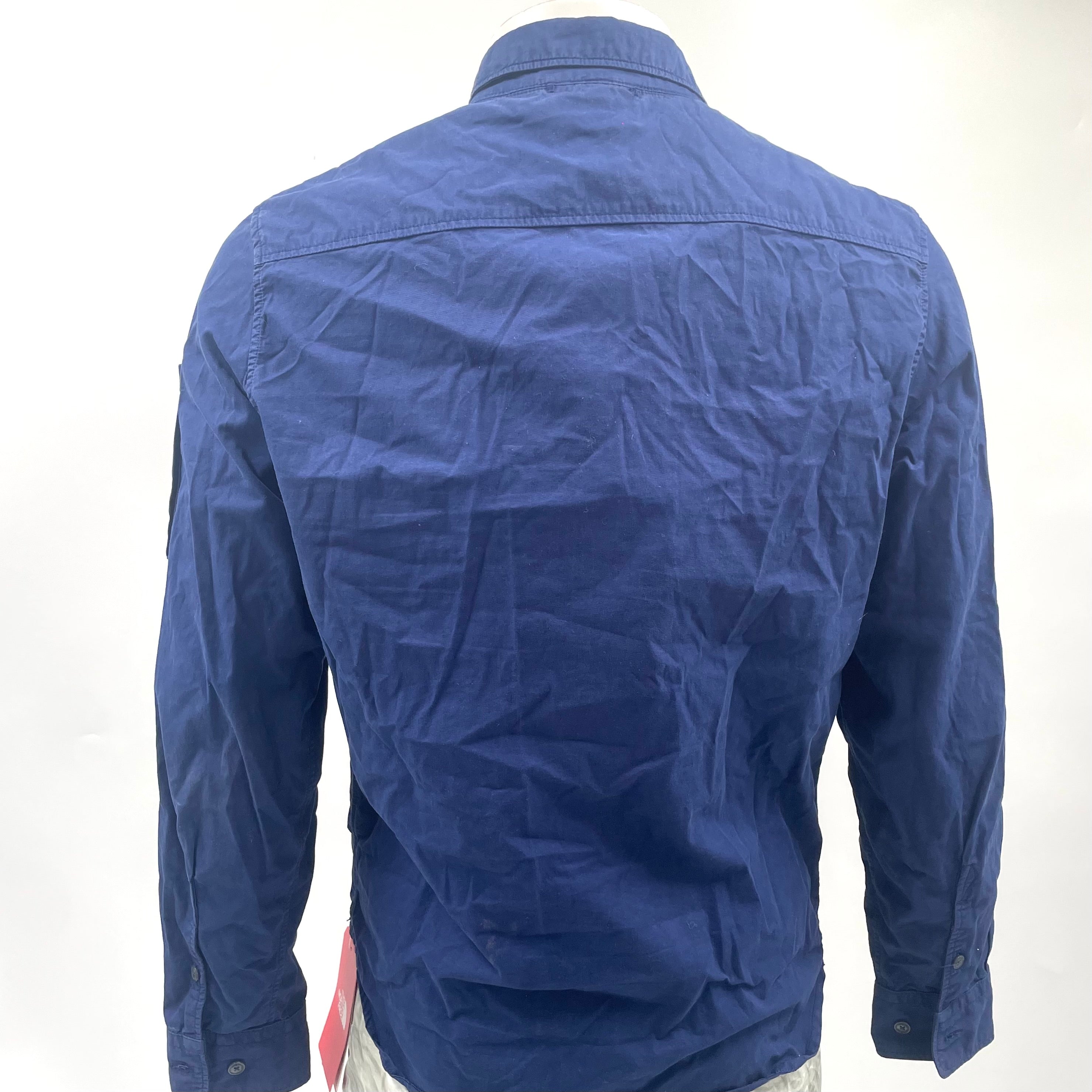 CP Company Navy Overshirt crafted from premium fabric, featuring a classic button-front design, signature C.P. Company