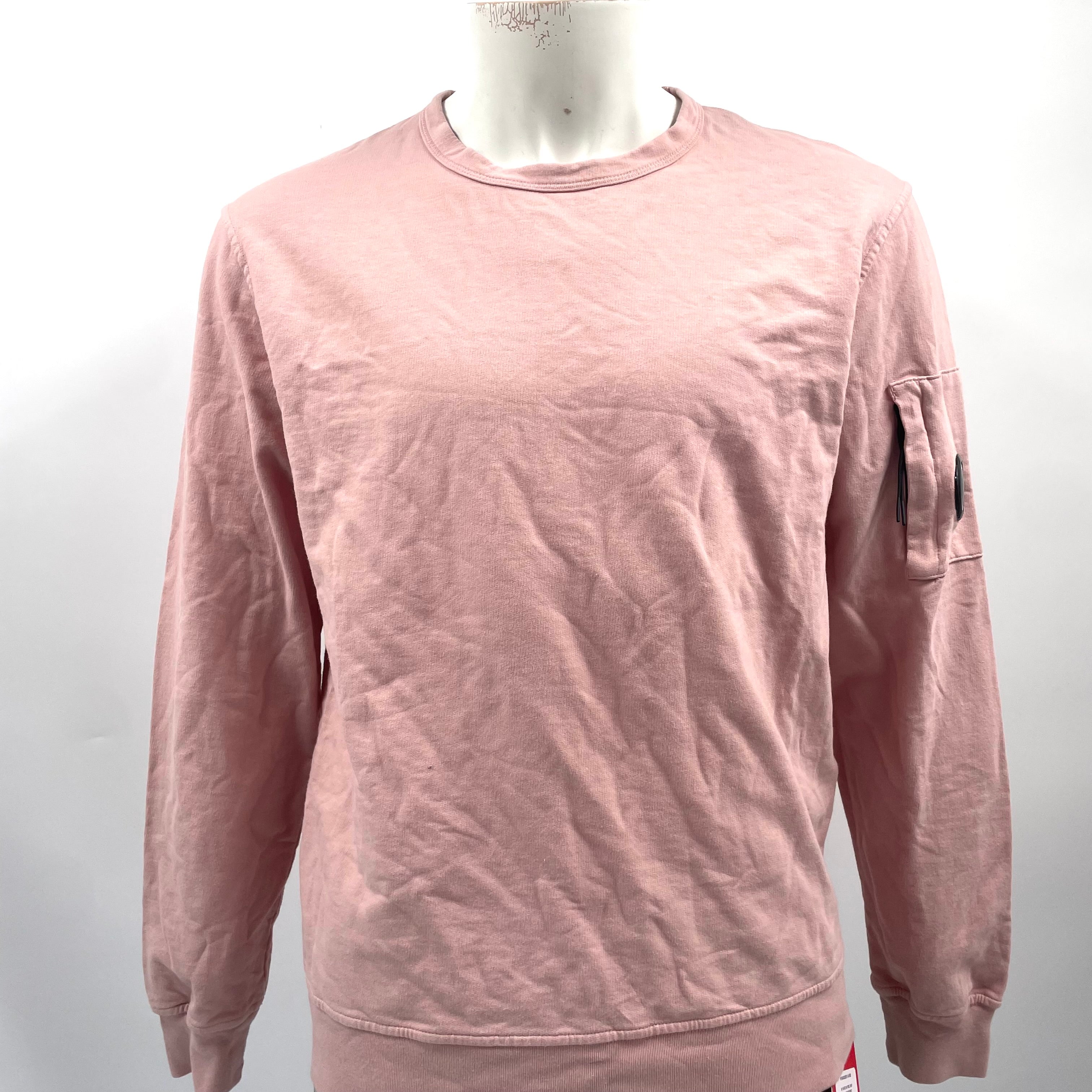 CP Company Pink Crewneck crafted from premium cotton, featuring a classic crew neck design, signature C.P. Company