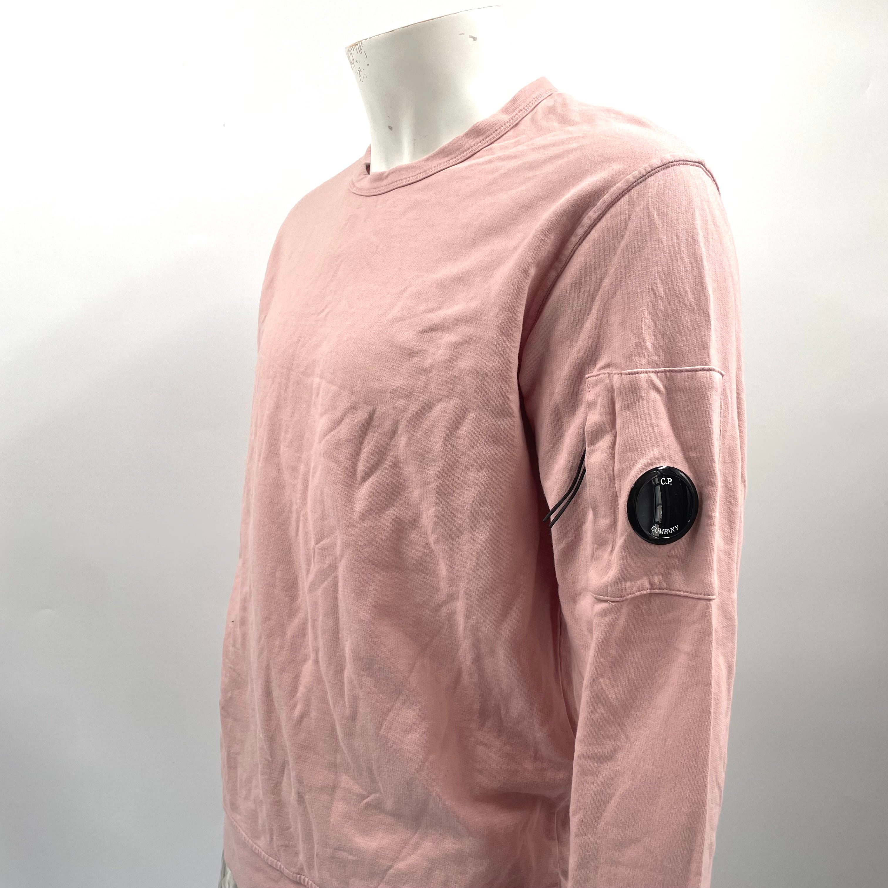 CP Company Pink Crewneck crafted from premium cotton, featuring a classic crew neck design, signature C.P. Company
