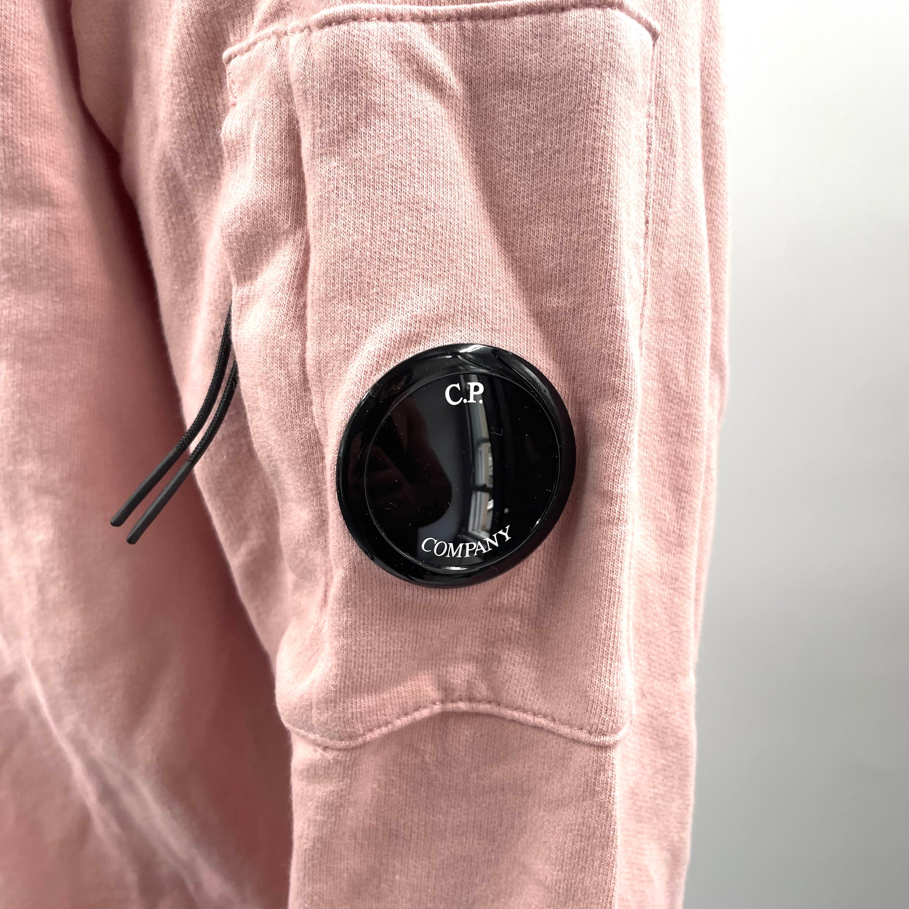 CP Company Pink Crewneck crafted from premium cotton, featuring a classic crew neck design, signature C.P. Company