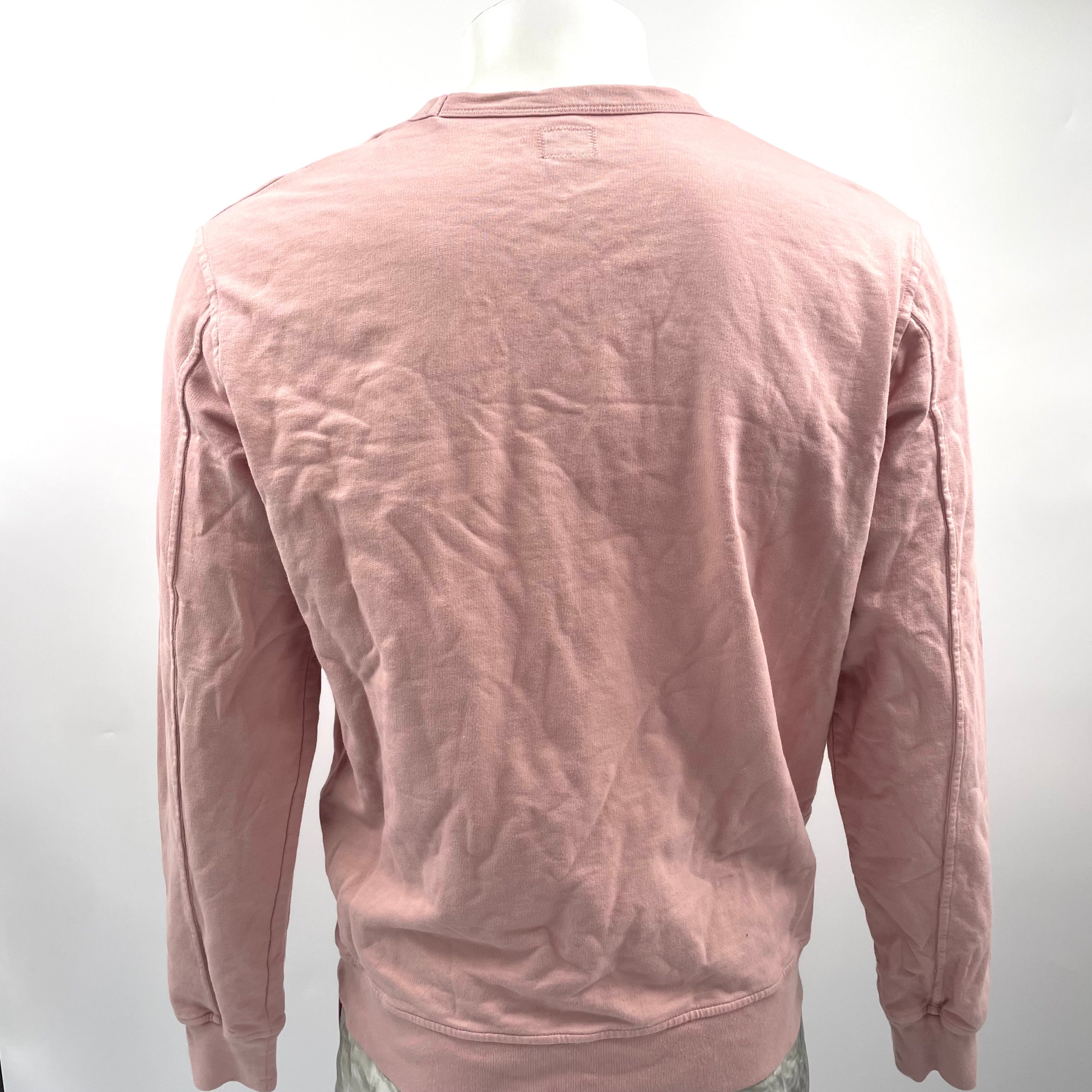 CP Company Pink Crewneck crafted from premium cotton, featuring a classic crew neck design, signature C.P. Company