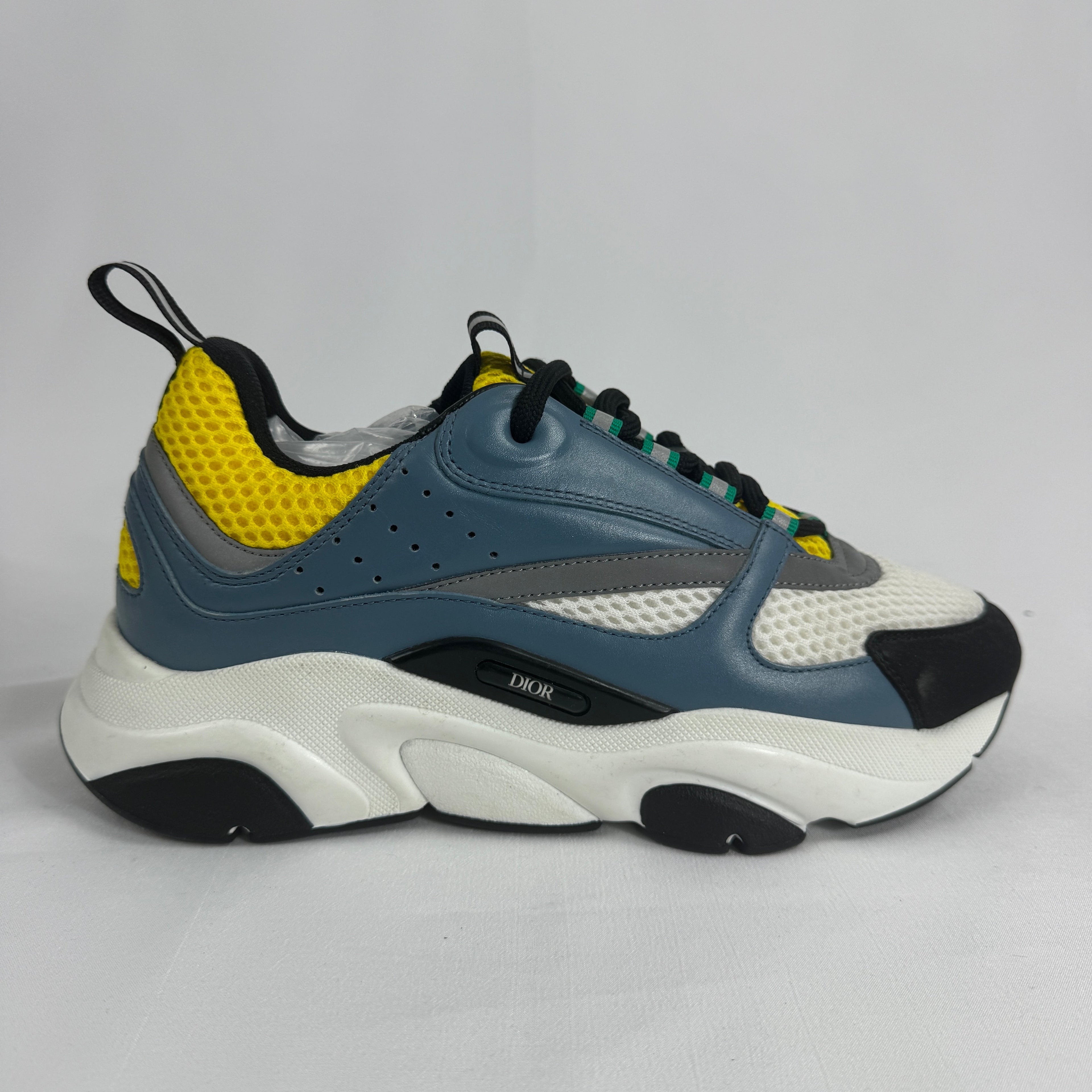 The Dior B22 Blue/Beige is a luxury chunky sneaker that blends retro running-inspired design with modern high-fashion style.