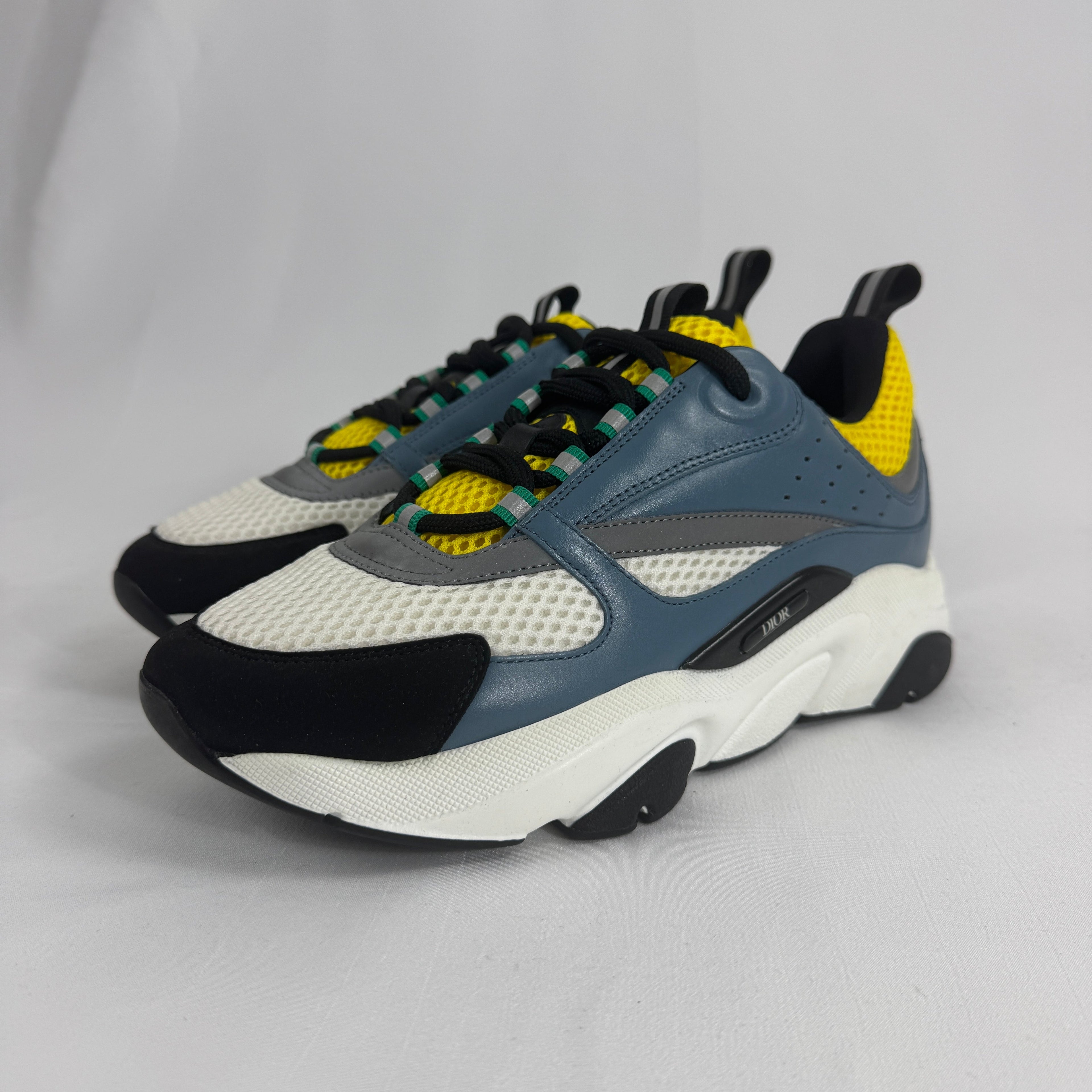 The Dior B22 Blue/Beige is a luxury chunky sneaker that blends retro running-inspired design with modern high-fashion style.