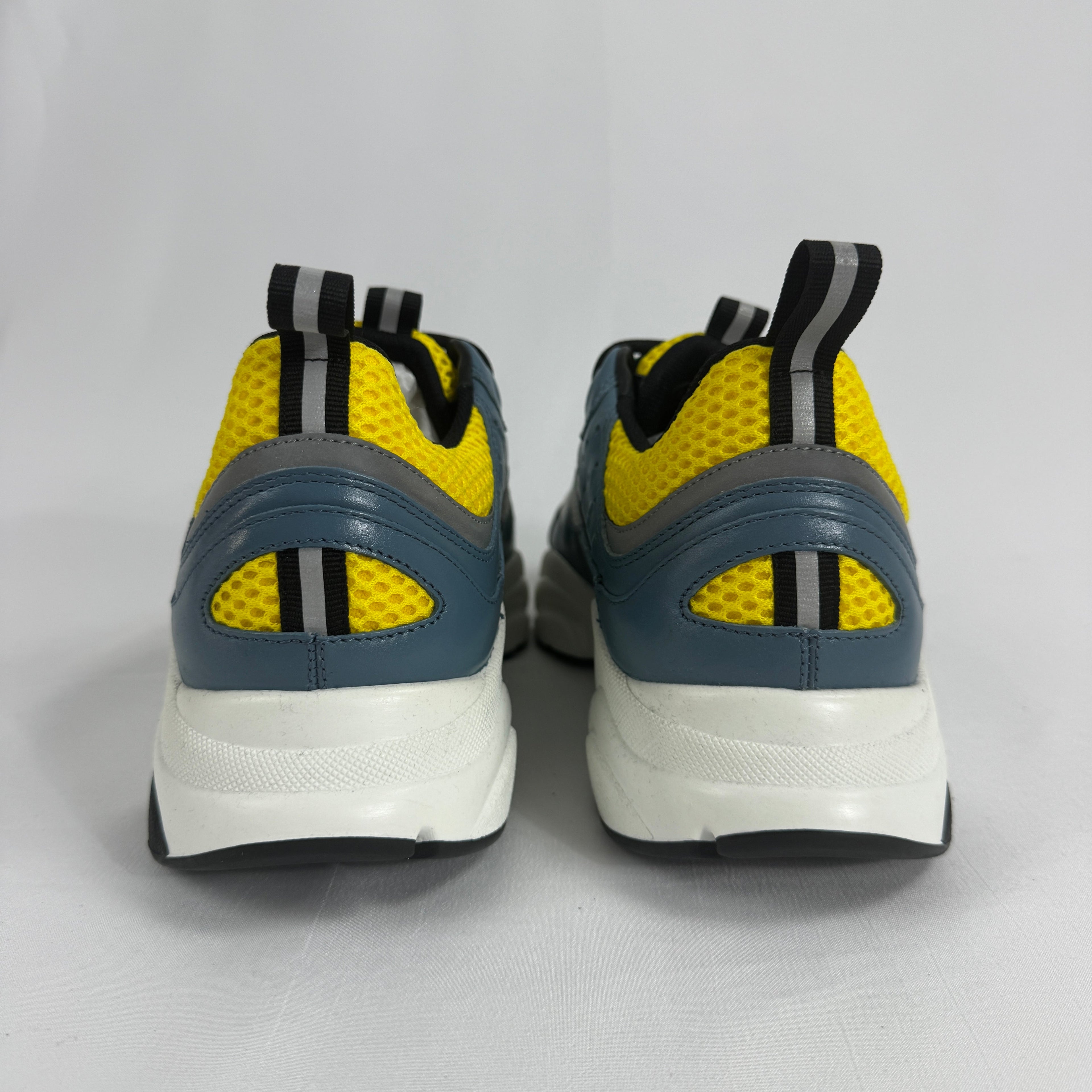 The Dior B22 Blue/Beige is a luxury chunky sneaker that blends retro running-inspired design with modern high-fashion style.