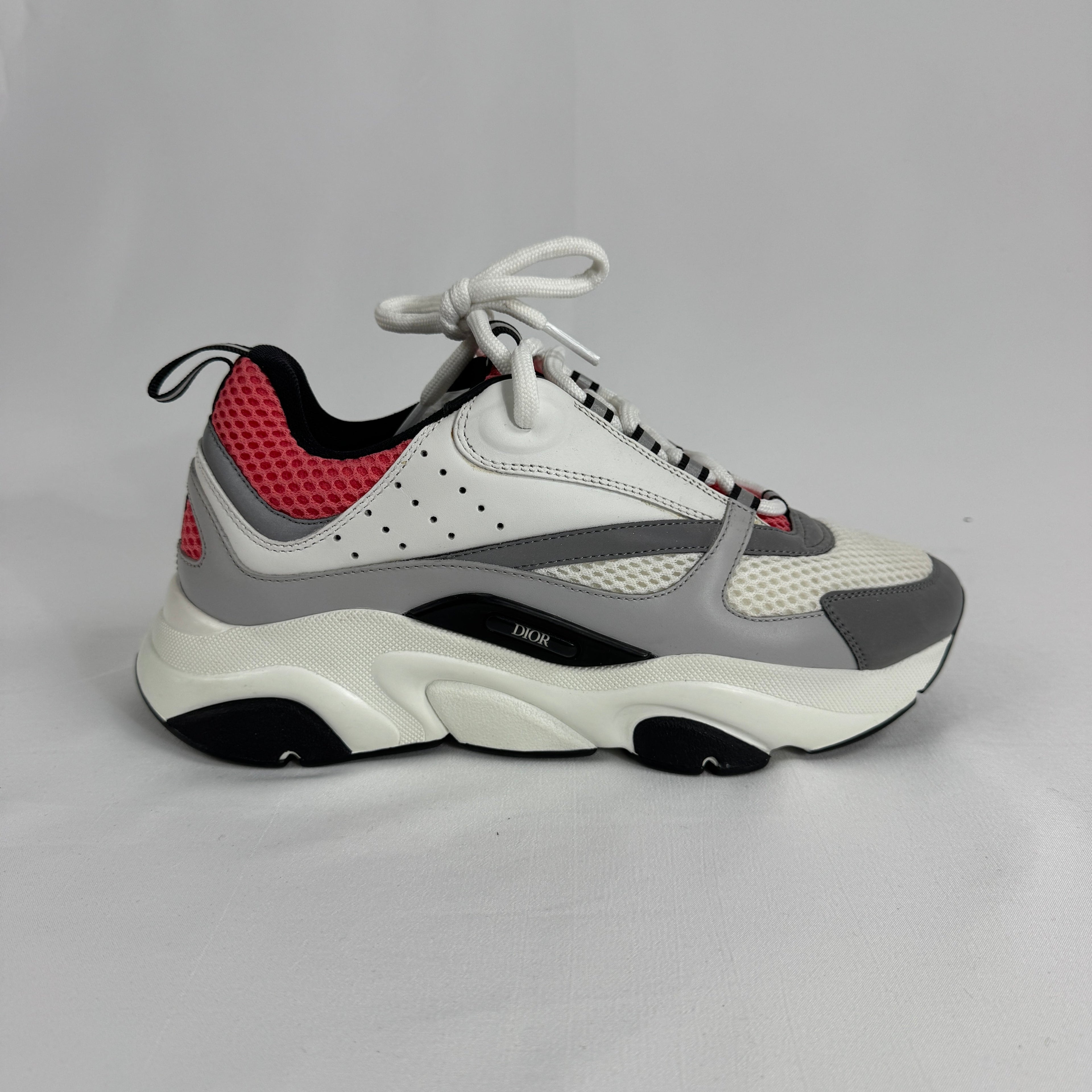 The Dior B22 White/Pink is a luxury sneaker that blends a chunky, retro-inspired silhouette with modern fashion appeal.