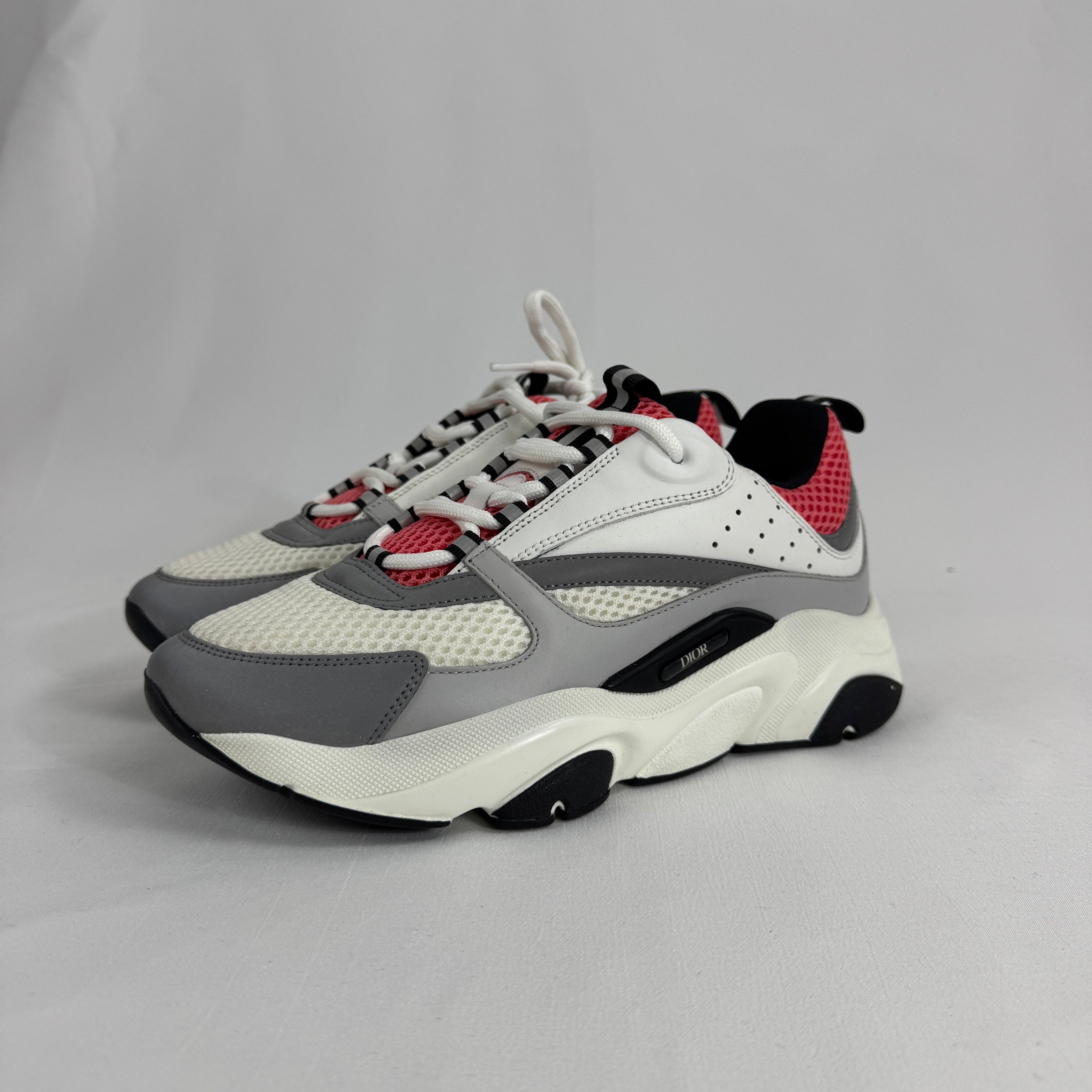 The Dior B22 White/Pink is a luxury sneaker that blends a chunky, retro-inspired silhouette with modern fashion appeal.