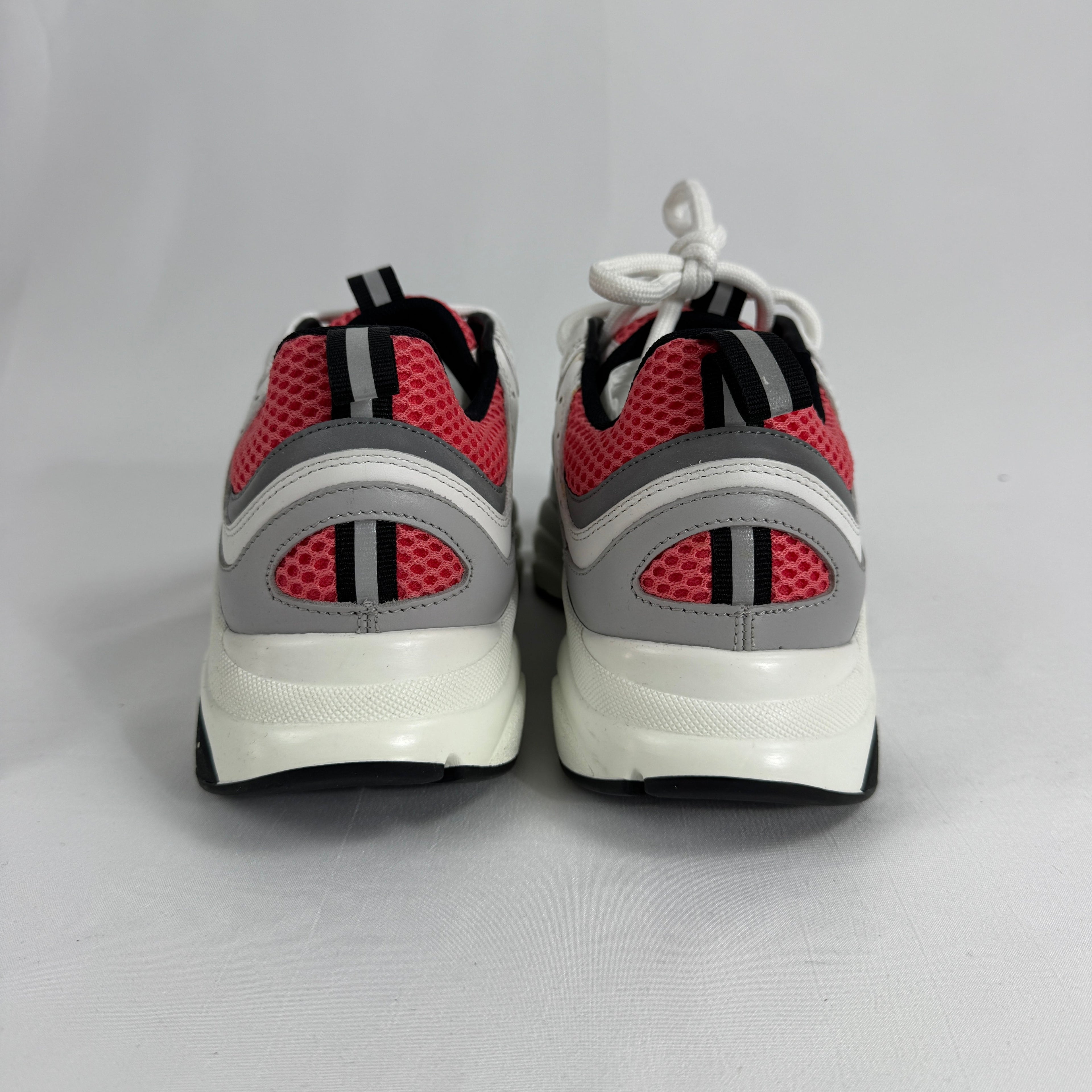 The Dior B22 White/Pink is a luxury sneaker that blends a chunky, retro-inspired silhouette with modern fashion appeal.