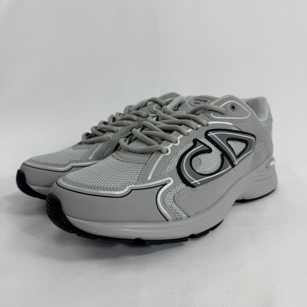 The Dior B30 Grey is a luxury sneaker featuring a technical mesh and microfiber upper in grey tones, with reflective