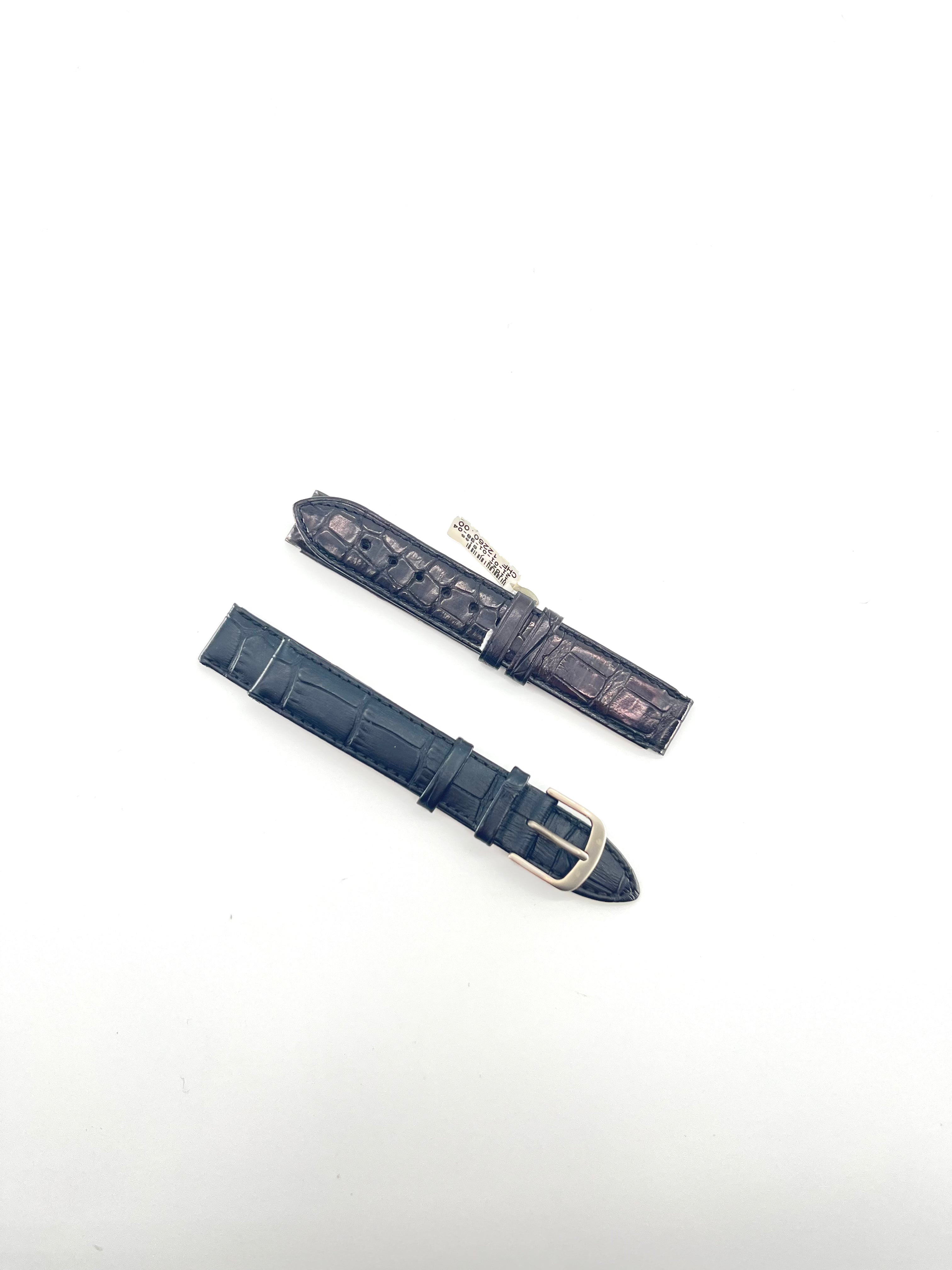 Two leather watch straps, one dark brown with a silver clasp and one black with a silver buckle, placed parallel on a white background.