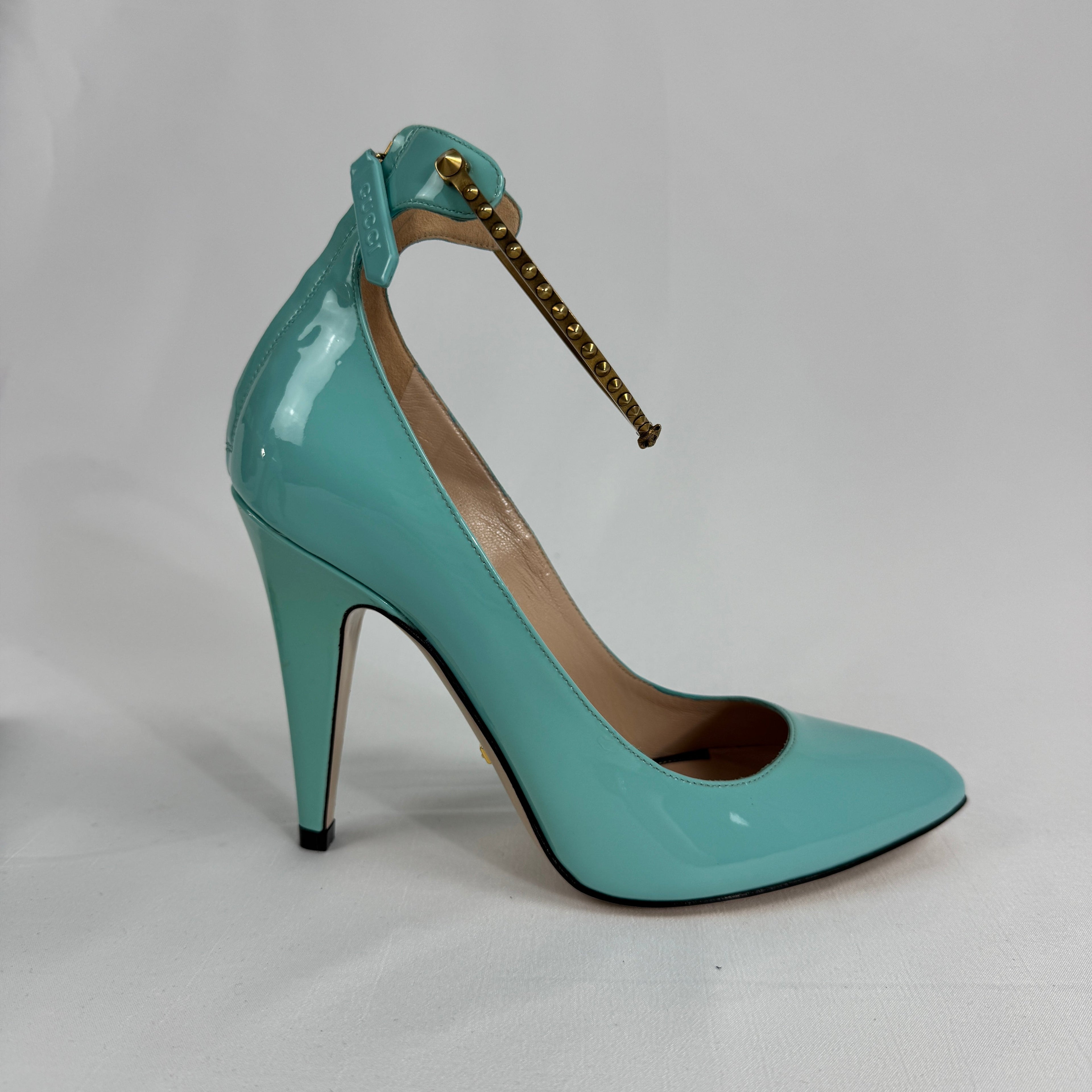 The Gucci Patent Leather Heels offer a sophisticated and timeless look, crafted from glossy patent leather for a polished