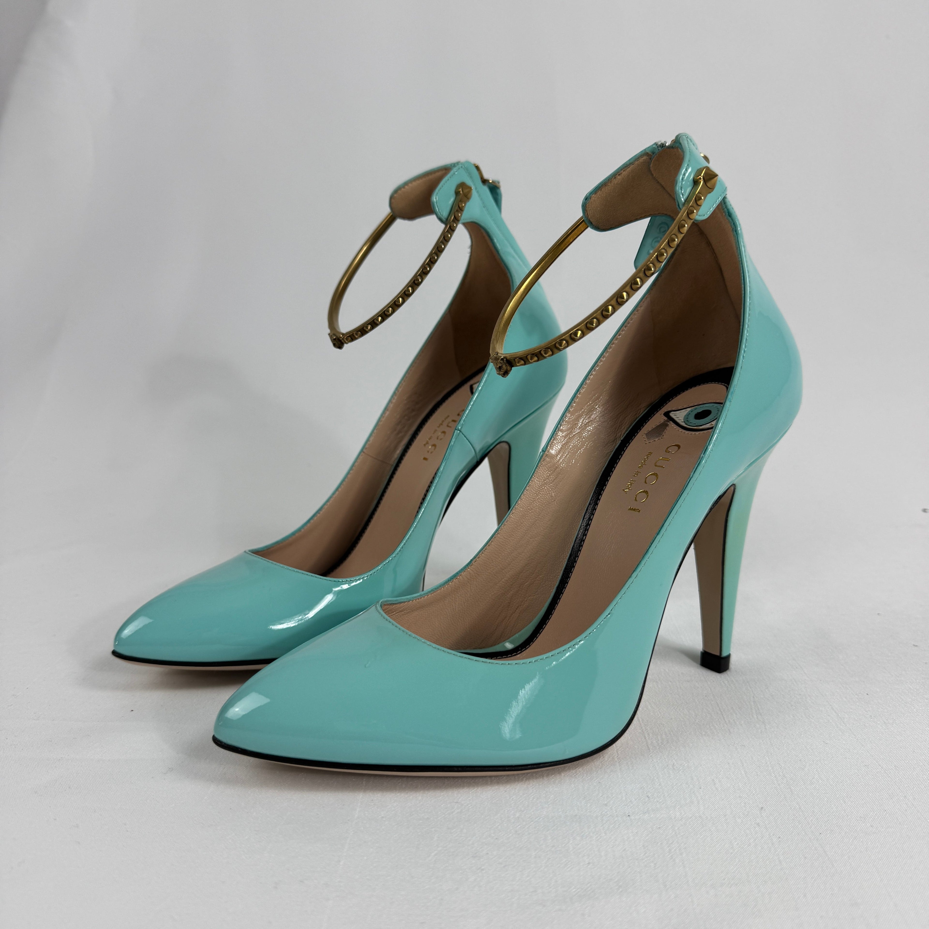 The Gucci Patent Leather Heels offer a sophisticated and timeless look, crafted from glossy patent leather for a polished