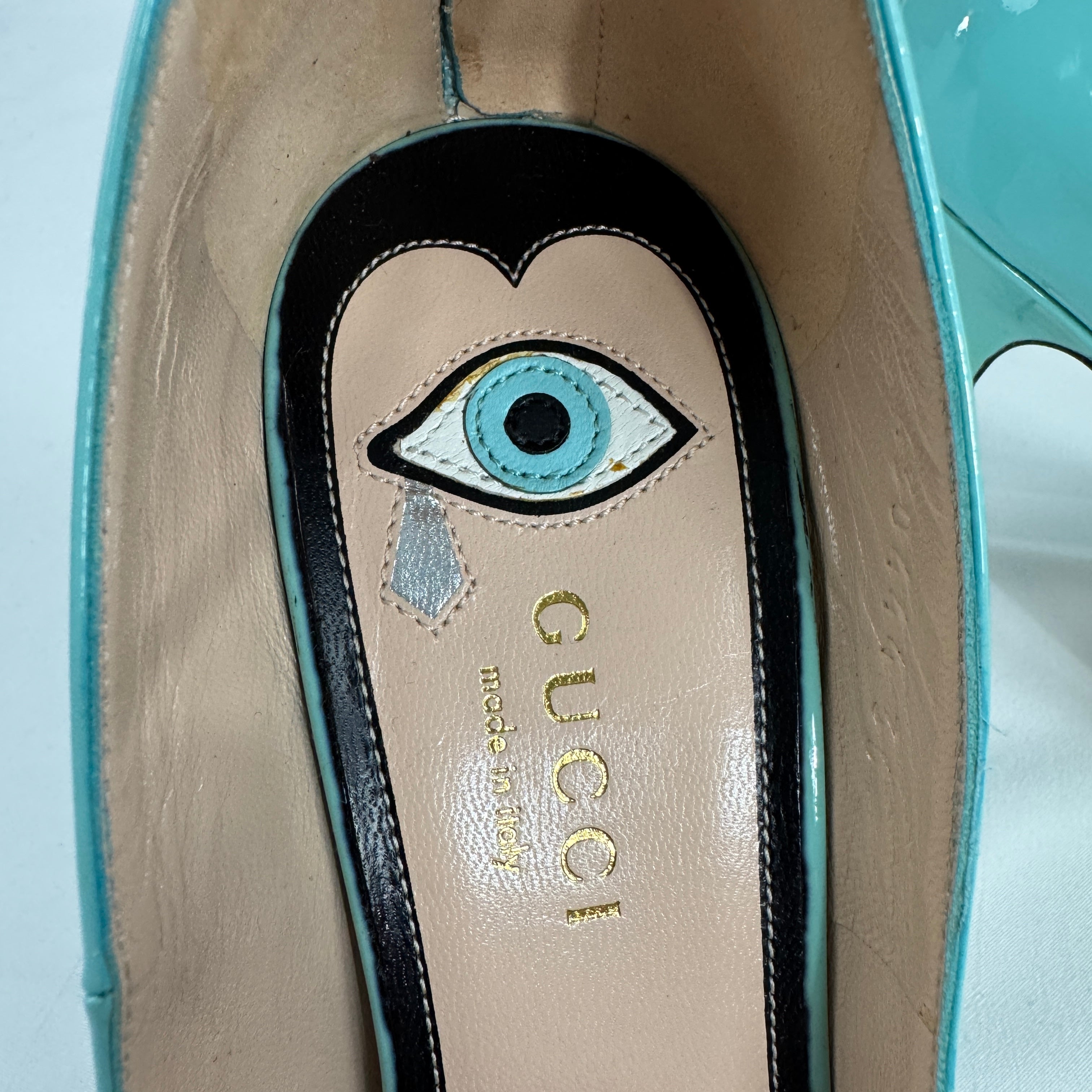 The Gucci Patent Leather Heels offer a sophisticated and timeless look, crafted from glossy patent leather for a polished