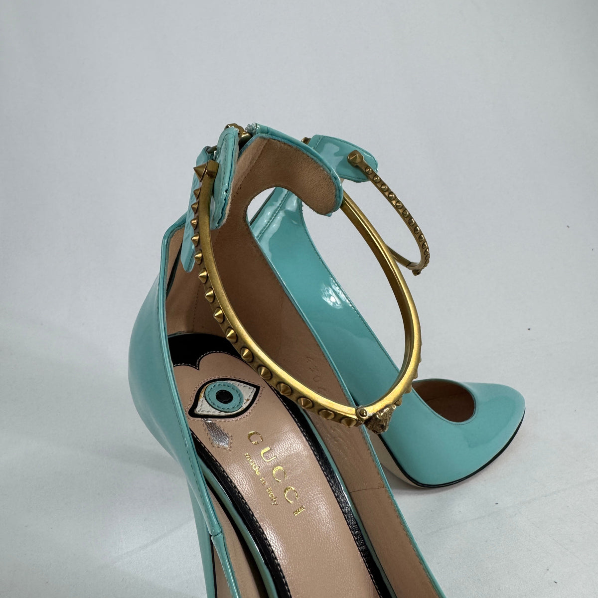 The Gucci Patent Leather Heels offer a sophisticated and timeless look, crafted from glossy patent leather for a polished